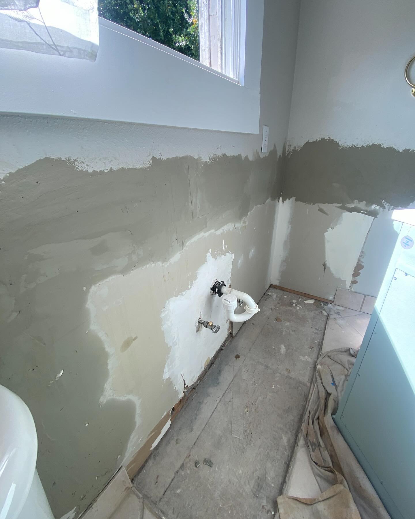 New bathroom vanity install! Usually bathroom vanities are a breeze and can be done in a matter of hours. This one was built into the wall and floor and installed before the tile work. No matching tiles could be found, so we filled the hole with self