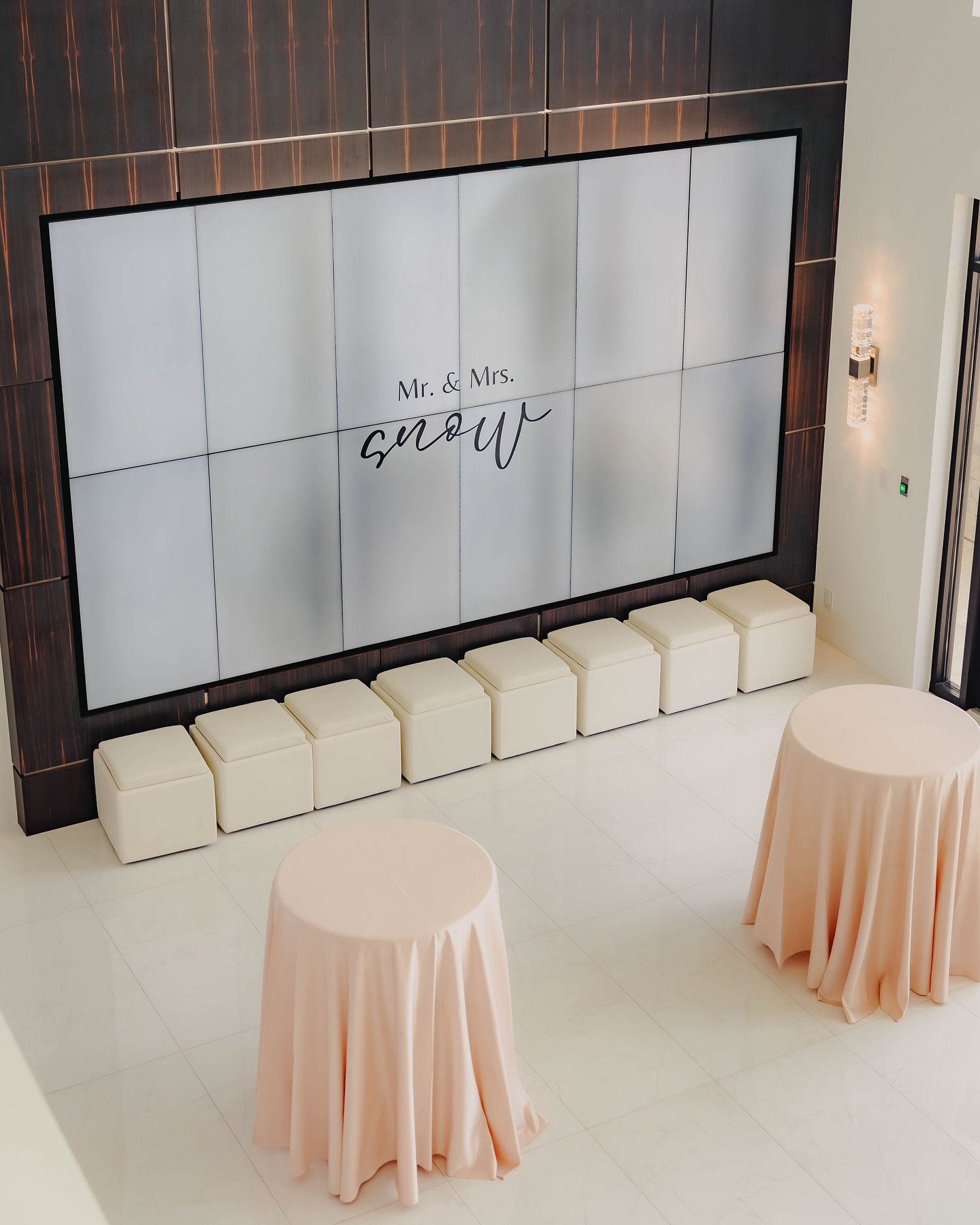This massive screen on our cocktail level is such a fun way to customize this space. Whether your adding your proposal video, a slideshow of your engagement pictures, your monogram, or the big game playing as people sip on their drinks and endugle in