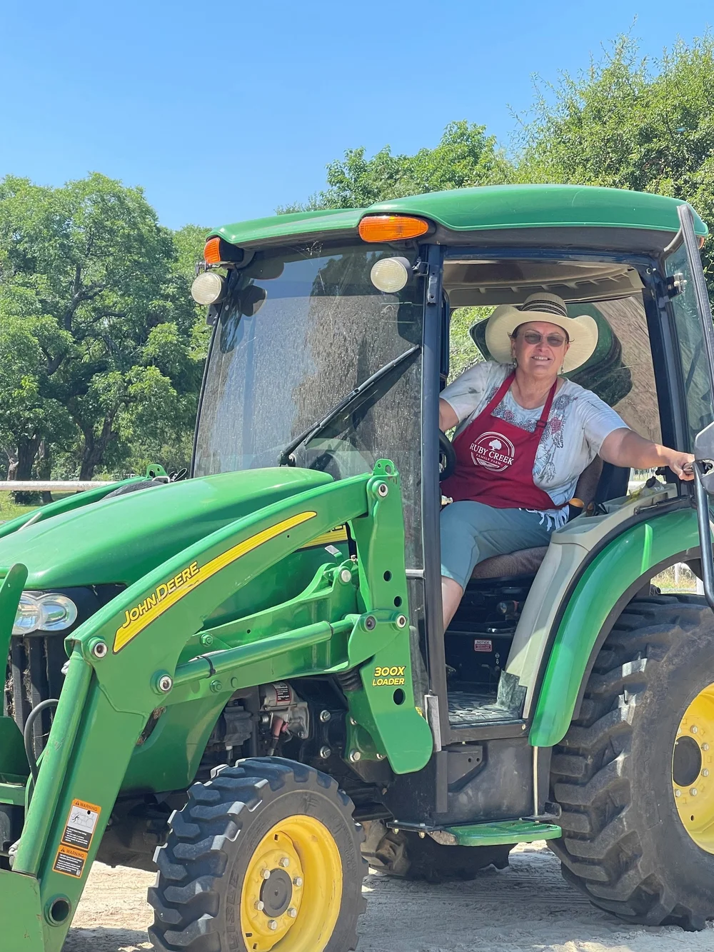 The farm tractor pulling the hayride out toward the pasture