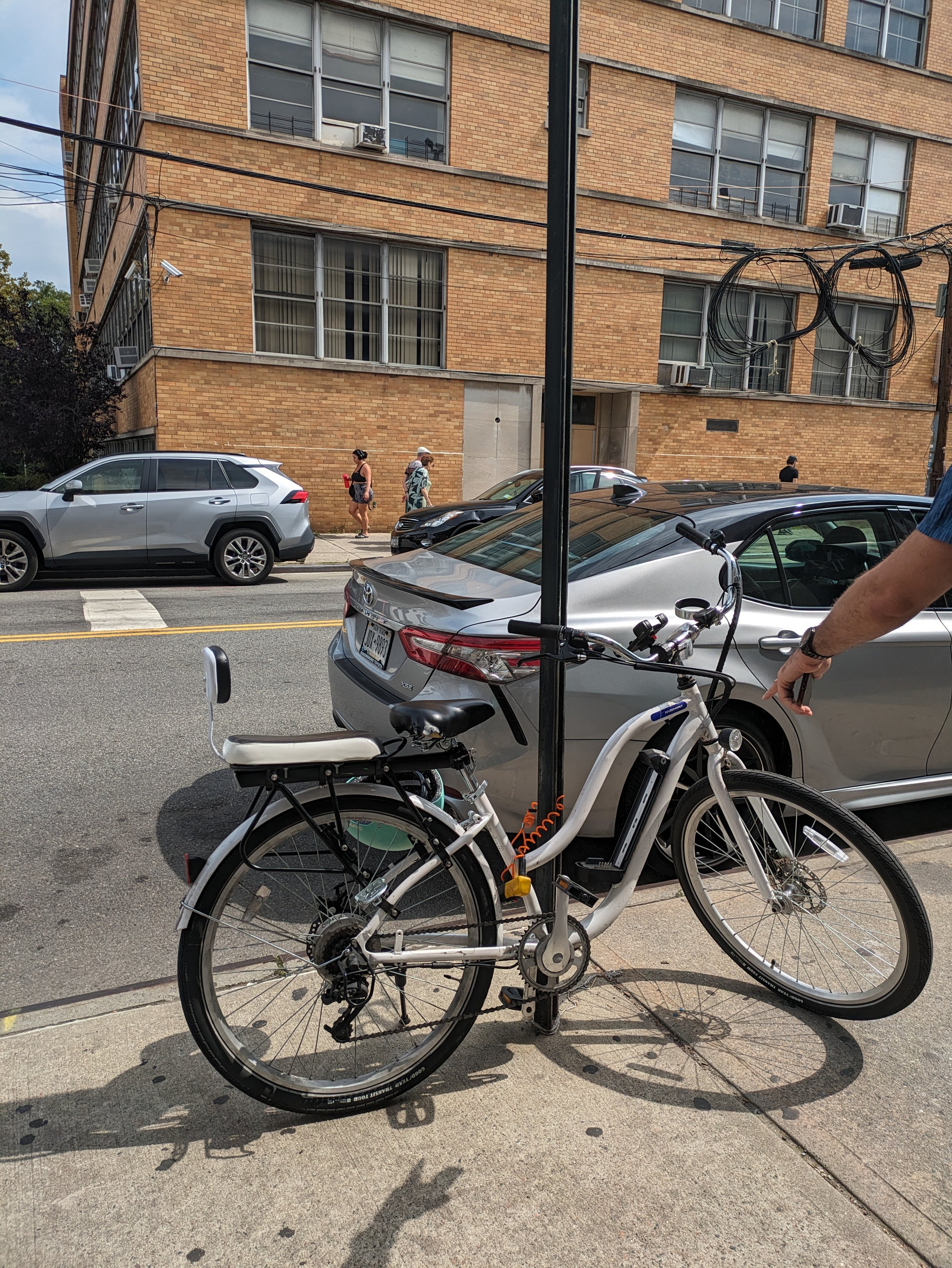 A bike attached to a traffic sign.