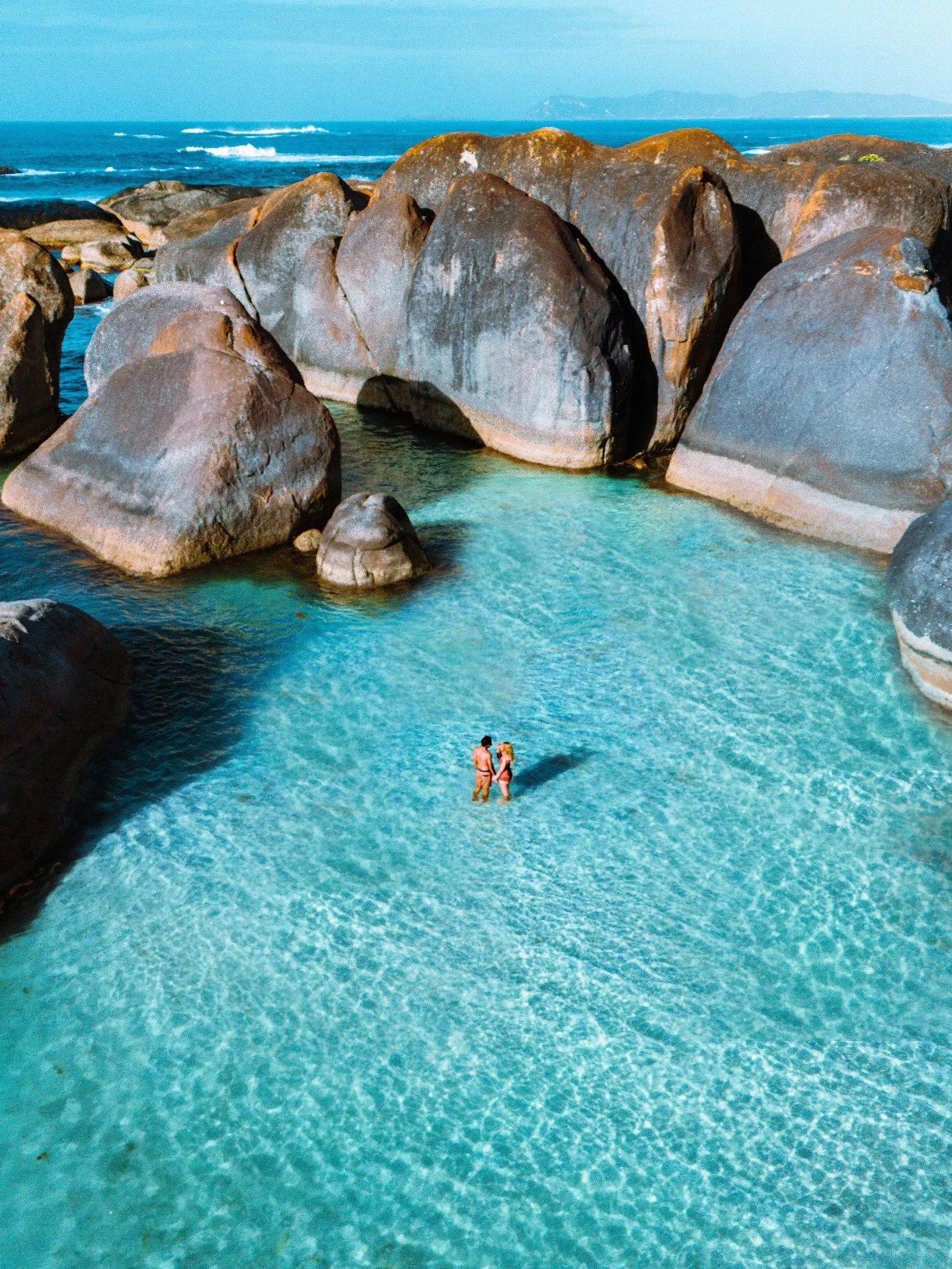 Framed by granite boulders and turquoise water, Elephant Rocks is one of those places that feels almost secret — a natural sculpture garden carved by wind, salt, and time.
Floating here, surrounded by the quiet rhythm of the Southern Ocean, yo