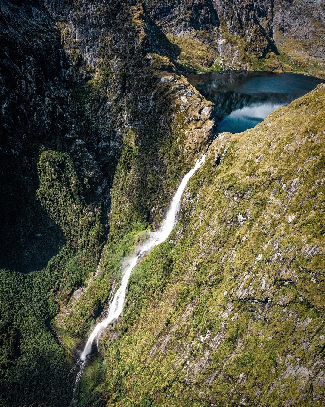 Plunging 580 metres through the misty cliffs of Fiordland, Sutherland Falls is a reminder of nature’s sheer scale and quiet power.
Standing at the base, feeling the spray on your face, it’s impossible not to pause - to simply be present