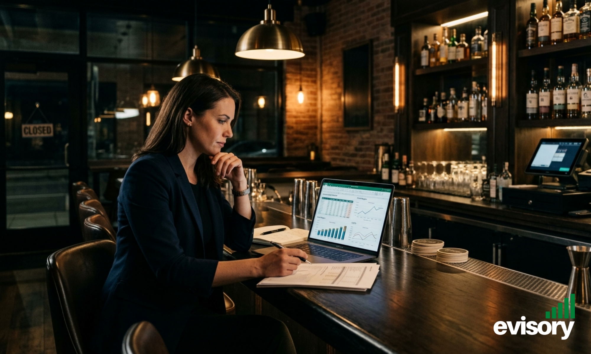 Bar owner reviewing weekly hospitality sales and gross profit reports