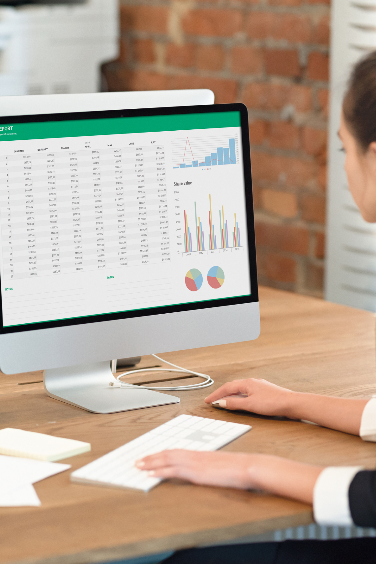 A woman looking at data on computer