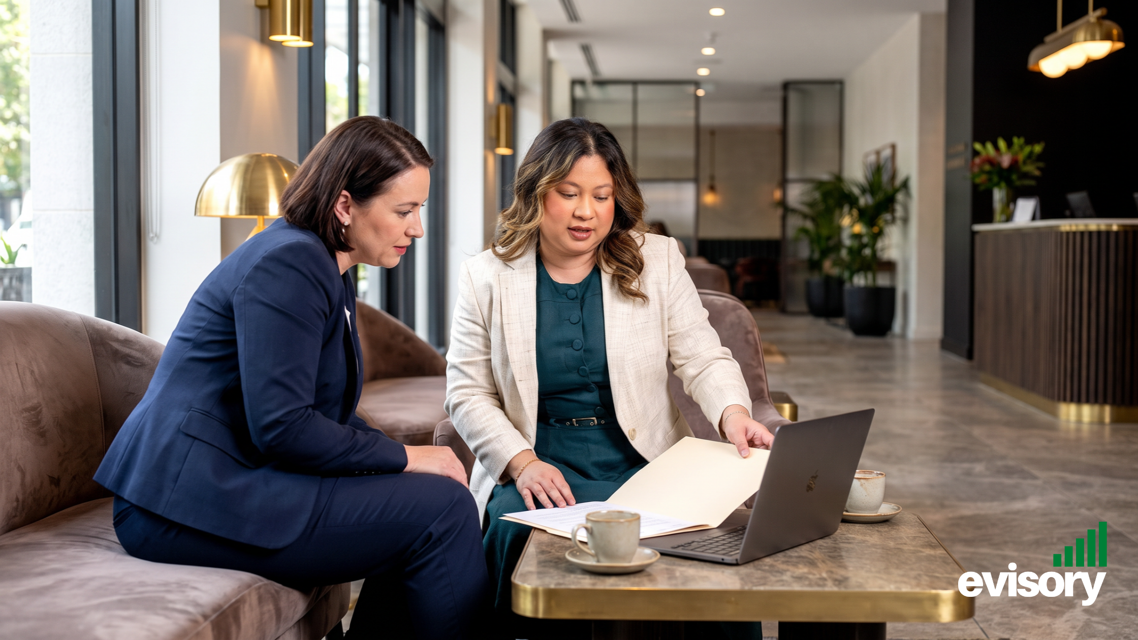Linda Dang reviewing WFH paperwork and asset records with a business client to ensure ATO FBT compliance and prevent tax audit traps.
