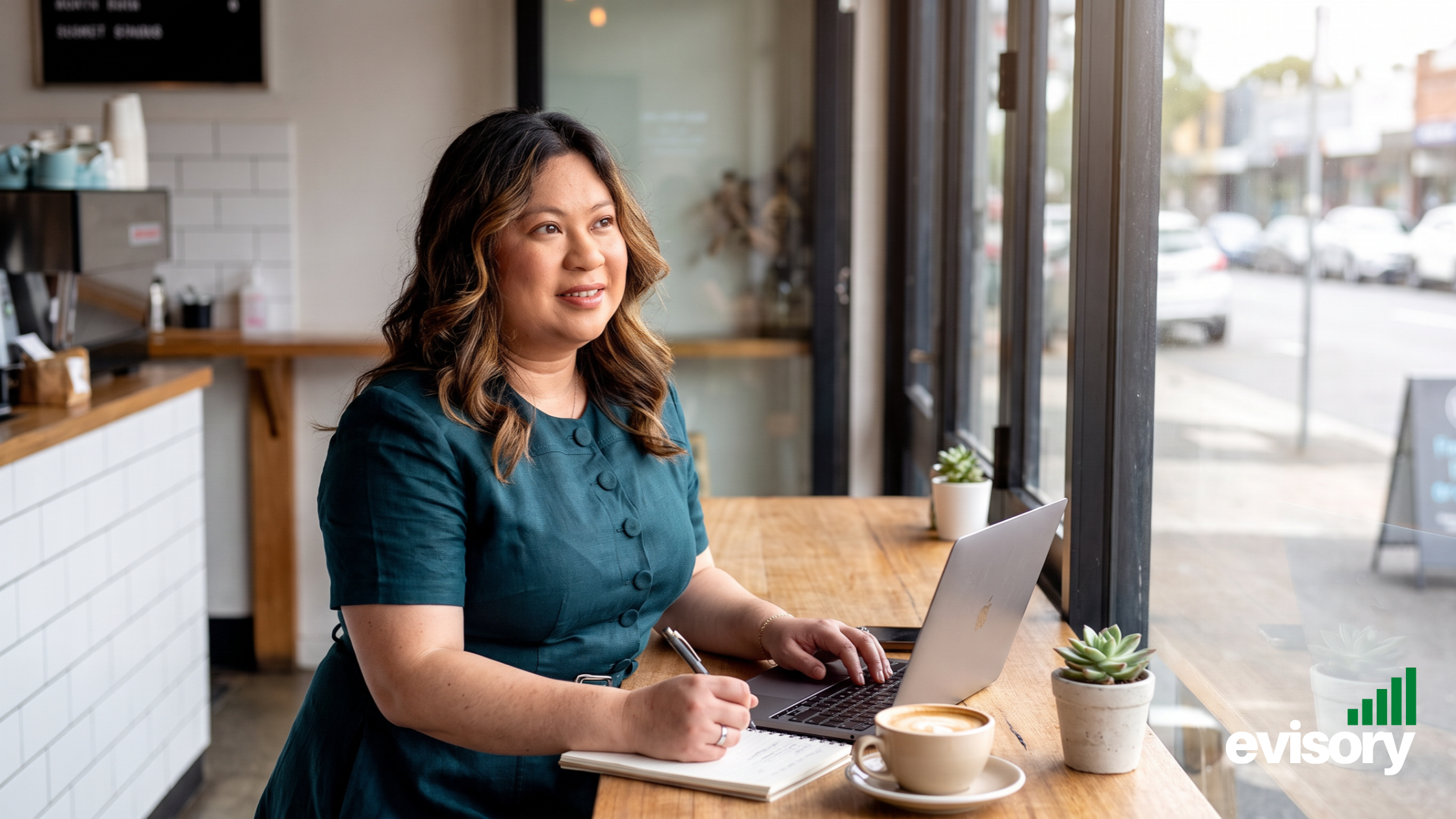 Linda Dang working on a laptop at a cafe, reflecting flexible remote work setups and Australian ATO Fringe Benefits Tax (FBT) compliance for employers.