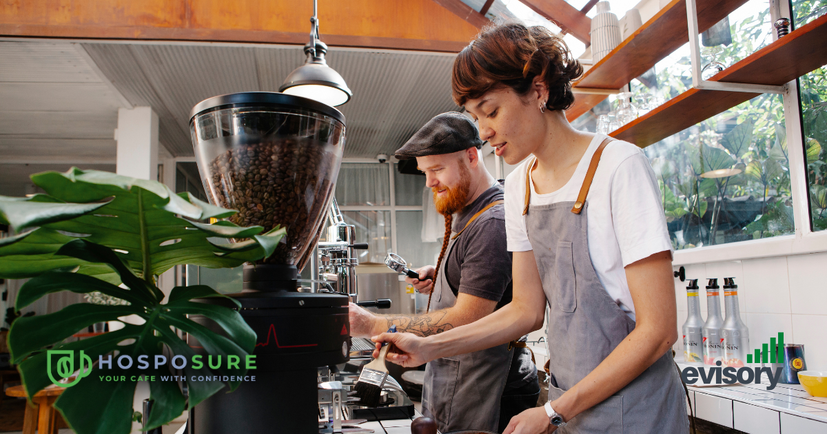 Baristas working behind the counter in a cafe, showcasing financial planning and forecasting with HospoSure and Evisory.
