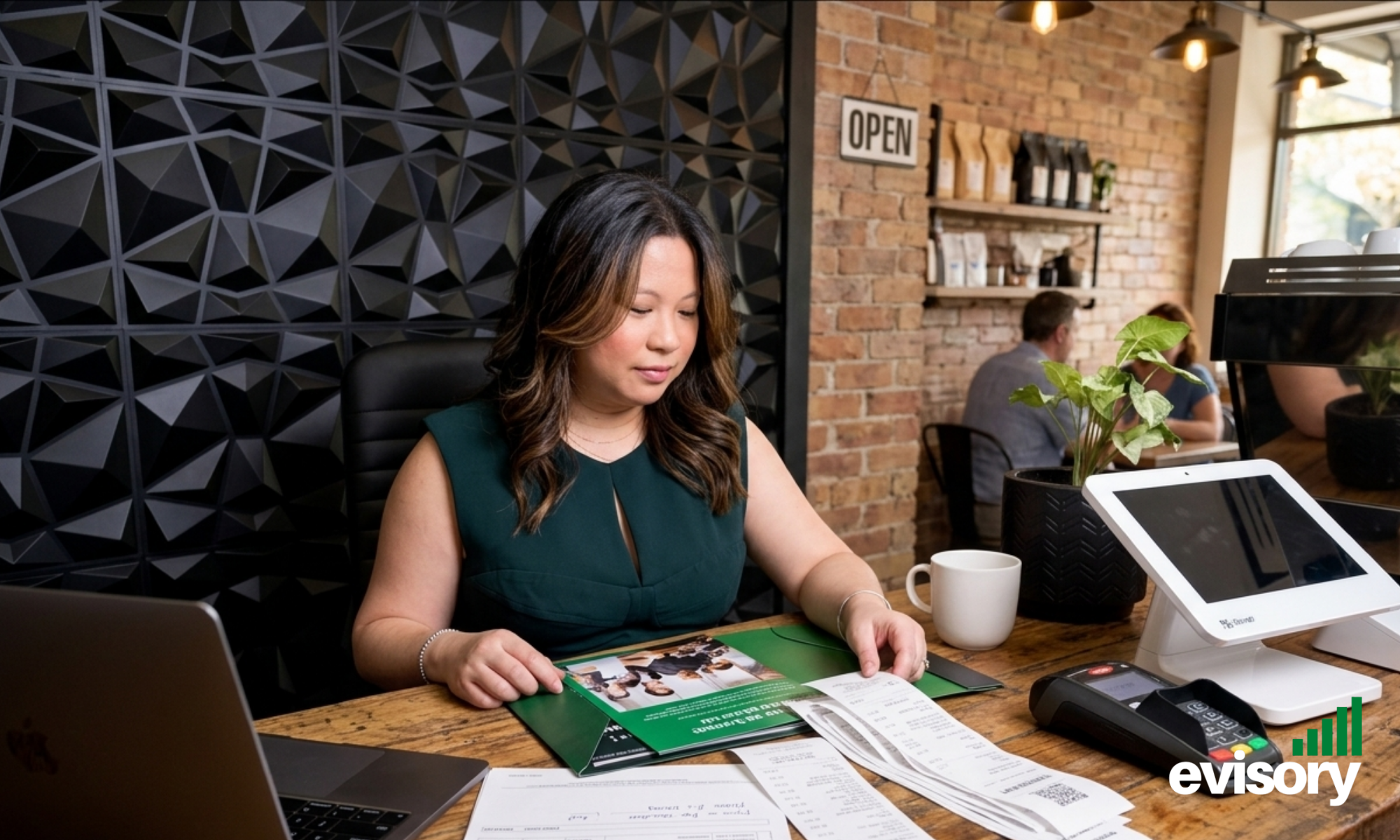 Linda Dang reviewing financial receipts and POS data in a cafe, helping hospitality venues avoid costly bookkeeping mistakes. By