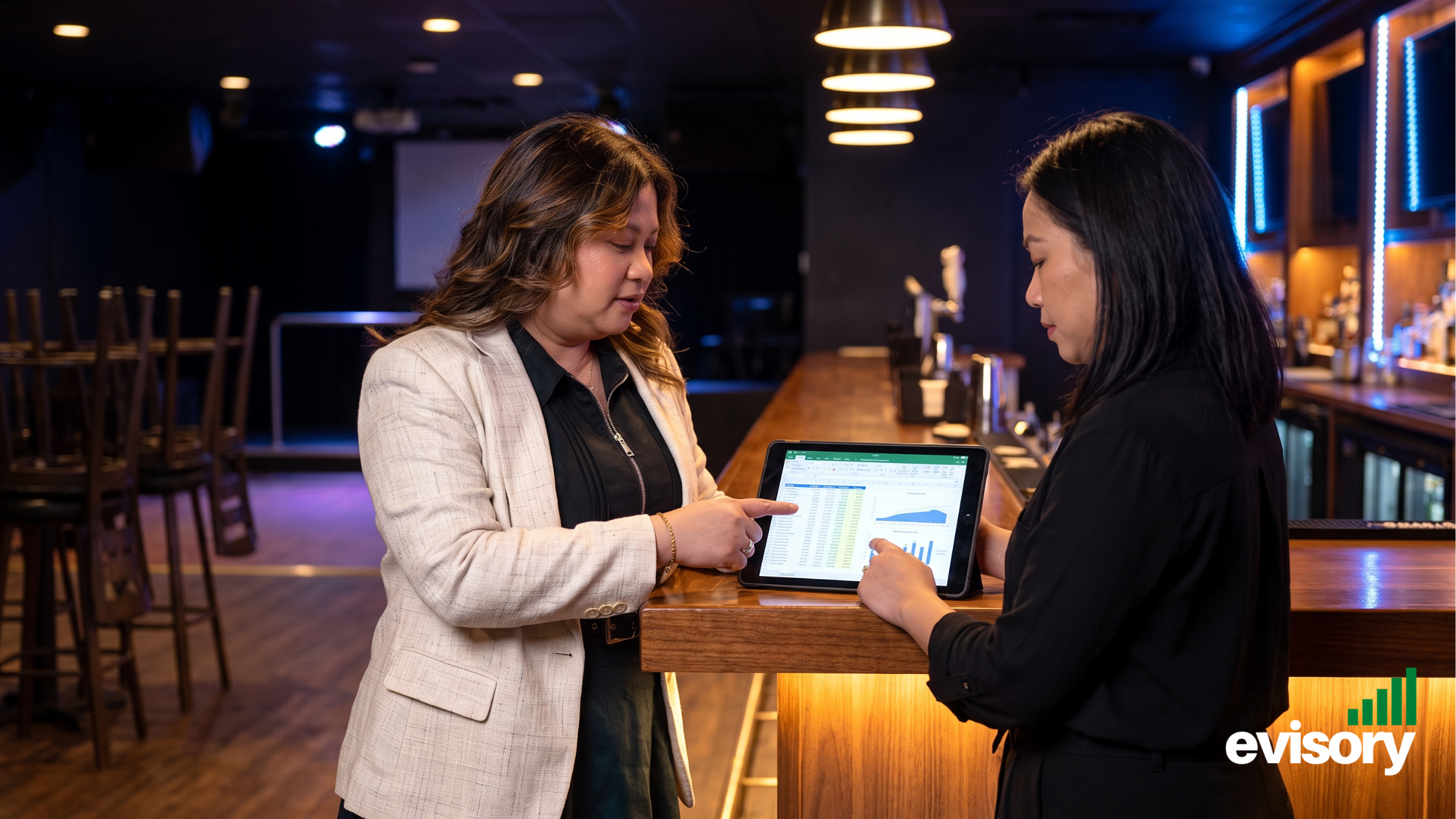 Linda Dang, Evisory CEO discussing hospitality bookkeeping with a venue owner