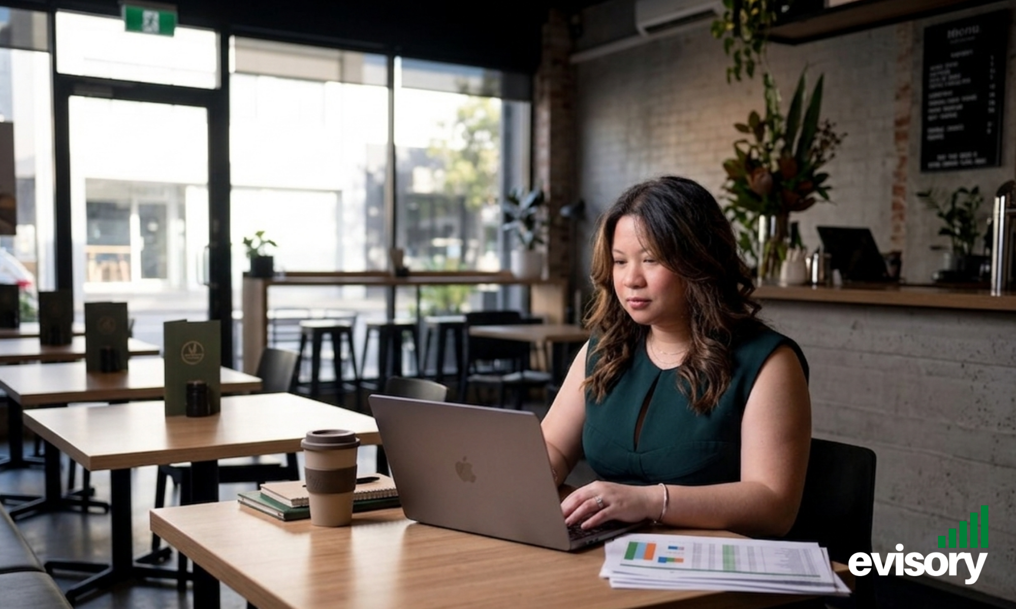 Hospitality venue owner reviewing weekly financial reports and KPI dashboards before opening