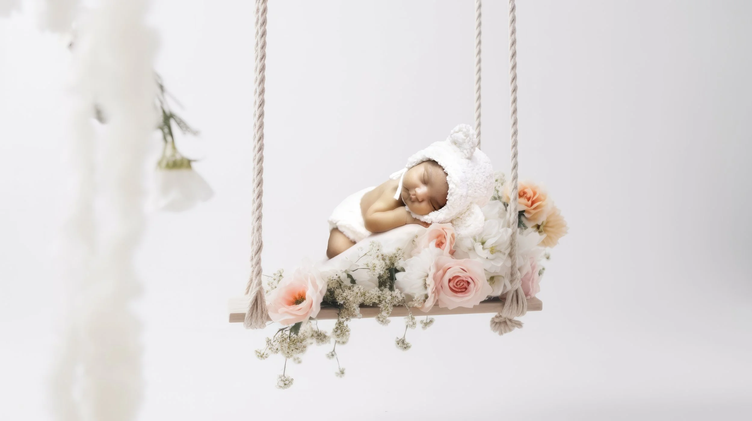 anabrandt_white_swing_on_white_background_with_soft_bloom_flowe_f1482e7a-2d23-4ee6-93d4-2acf713bccbe-topaz copy.jpg