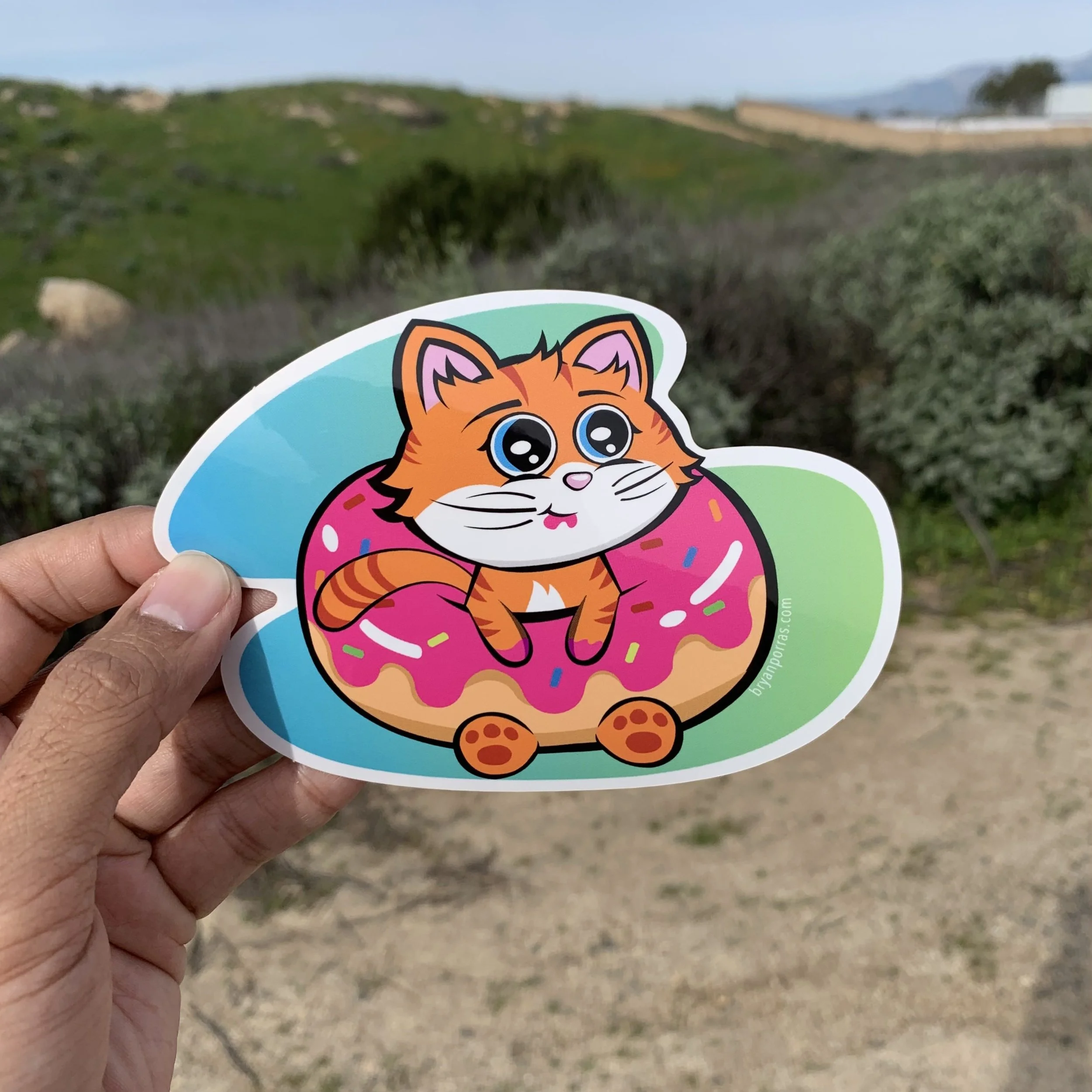 Cat Eating Donut Sticker (5"W X 3.6"H)