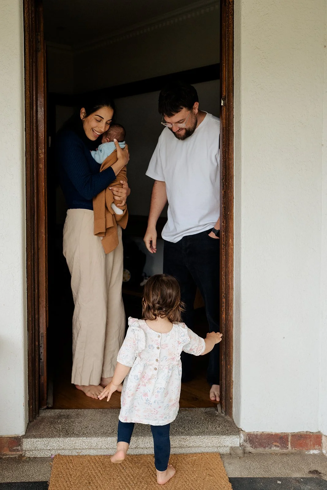 Newborn and big sister mum and dad at home.jpg