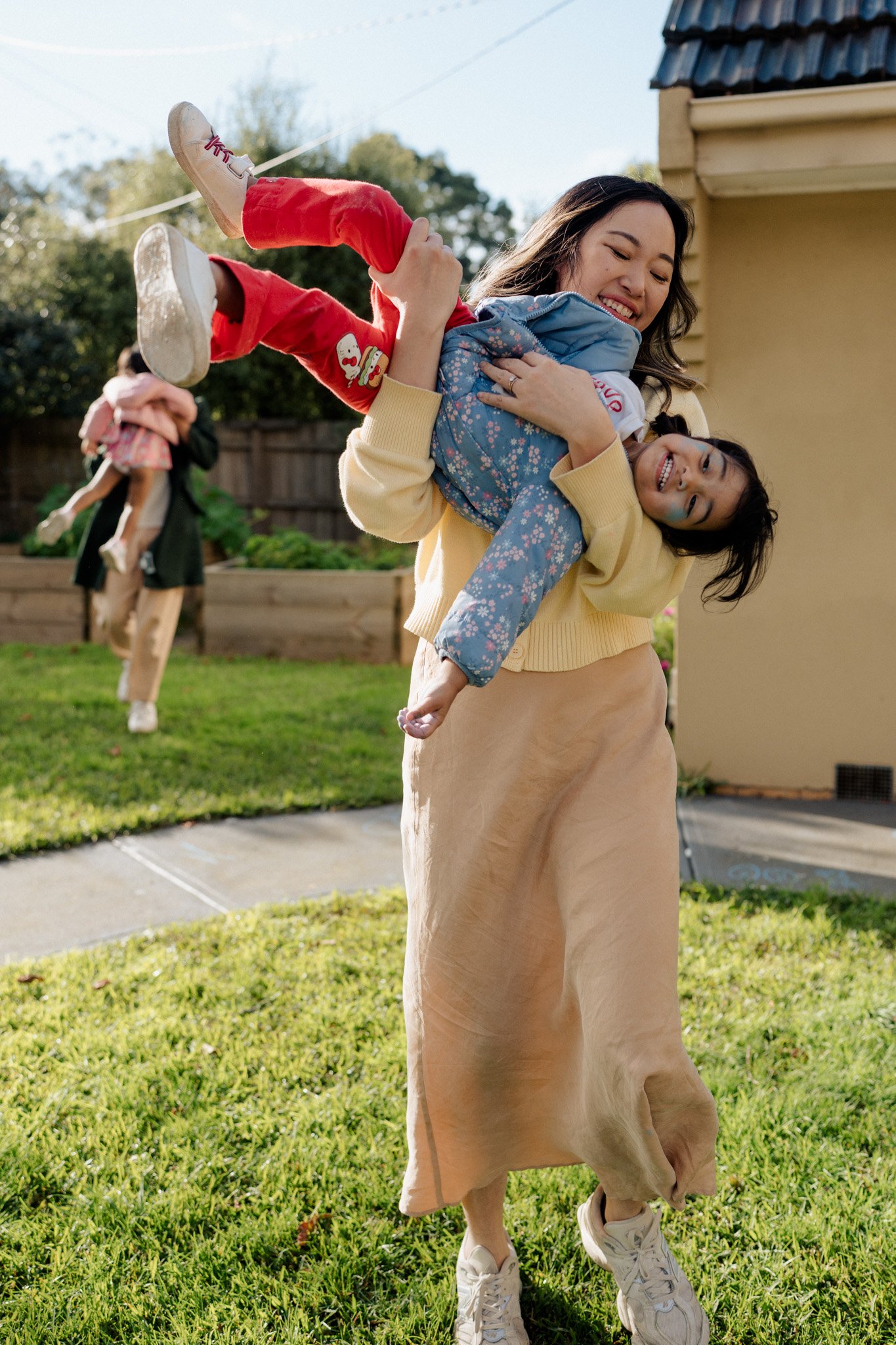 Here is the magic sauce for creating beautiful photos just like these...

A family willing to step into their front yard (even when it's freezing).
Some chalk (that starts on the footpath and somehow ends up all over the kids' faces).
A game of chase