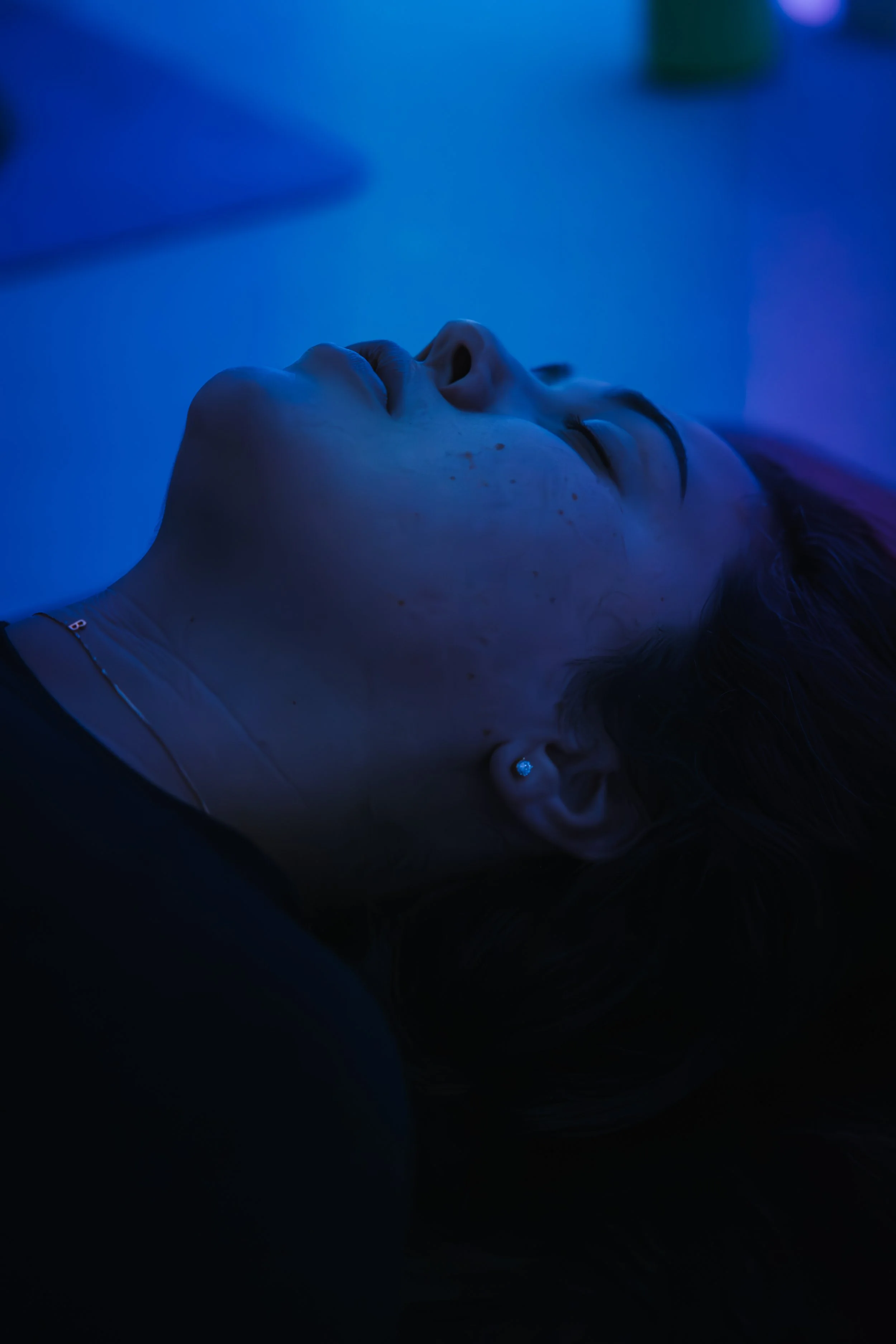 A participant resting during a Breath Haus session at THE LUME