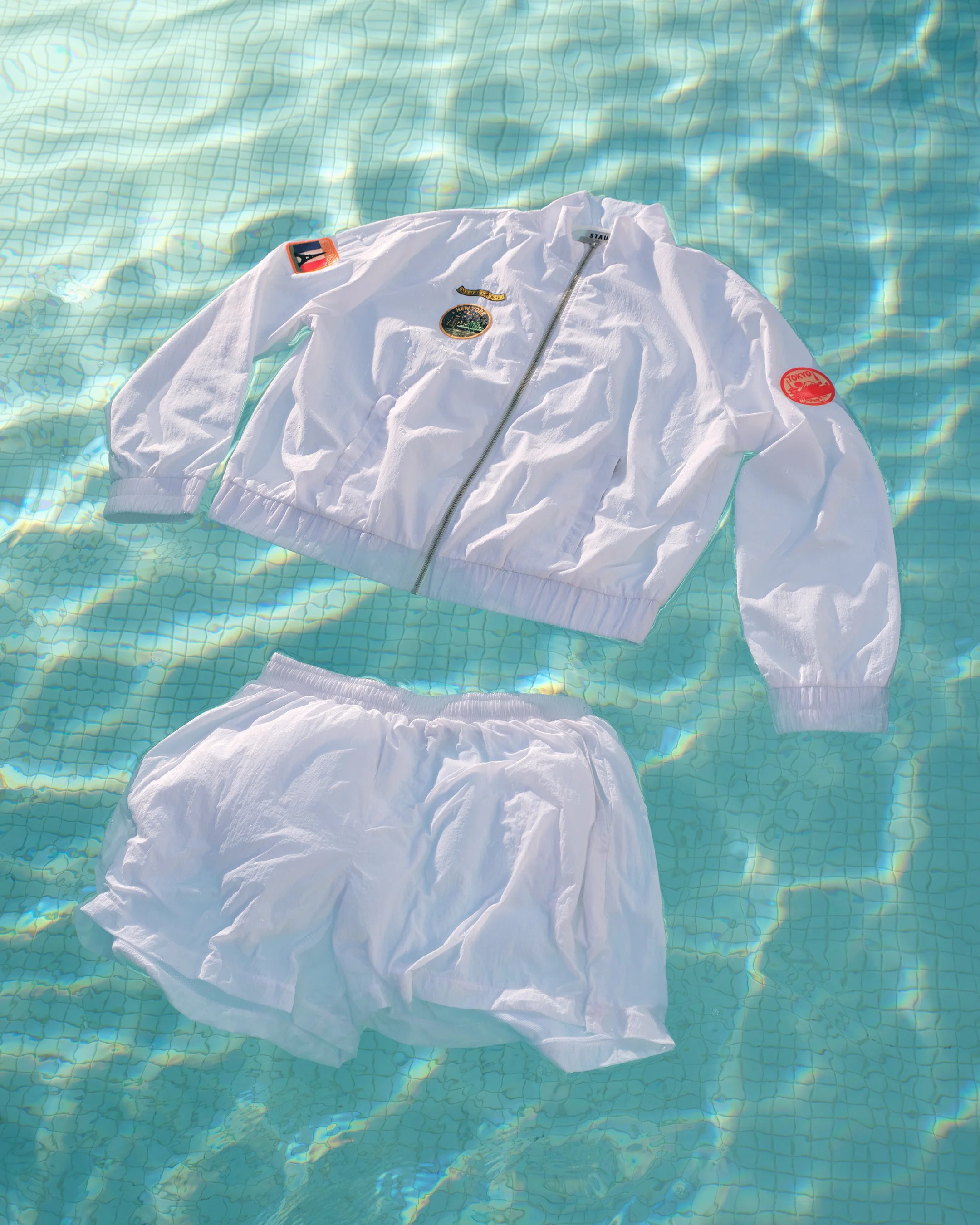 Amex_GoldxStaud_ArrivalJacket-Shorts-Vertical_4x5.jpg