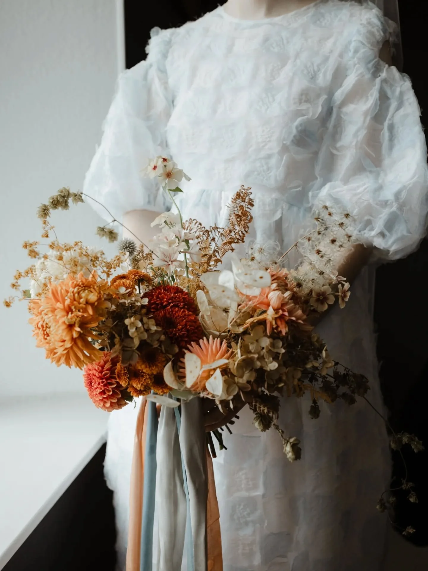 A November wedding that was pure joy all the way through. 

Early conversations about licheny branches, dried hydrangeas, hop bines and little heritage squash got me giddy from the get go; bringing together late autumn textures to fill the beautiful 