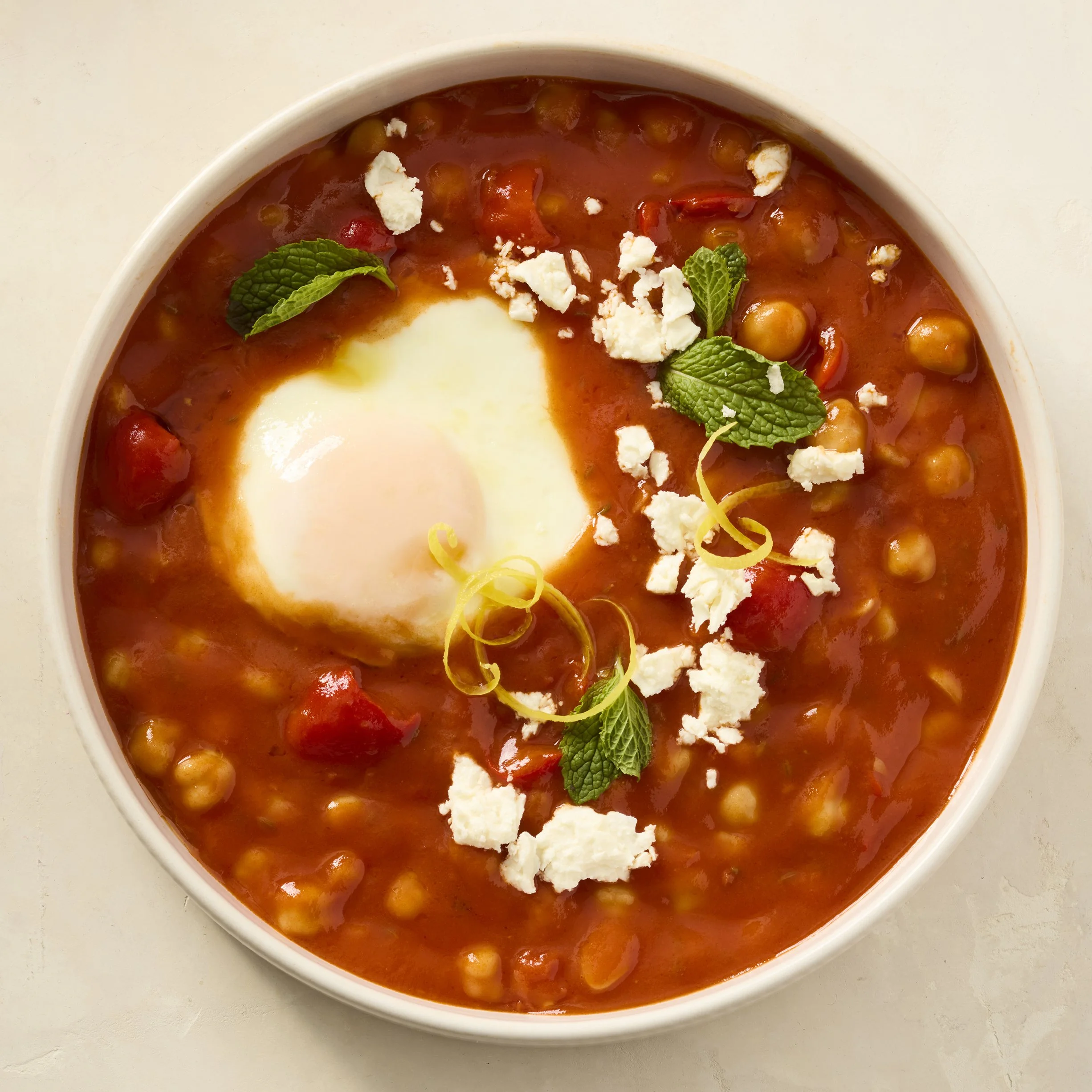 A bowl of Shakshouka with a perfect poached egg inside - shot for Campbell's Food Group - photographed by Johnny Fogg - food styling, commercial food stylist NYC