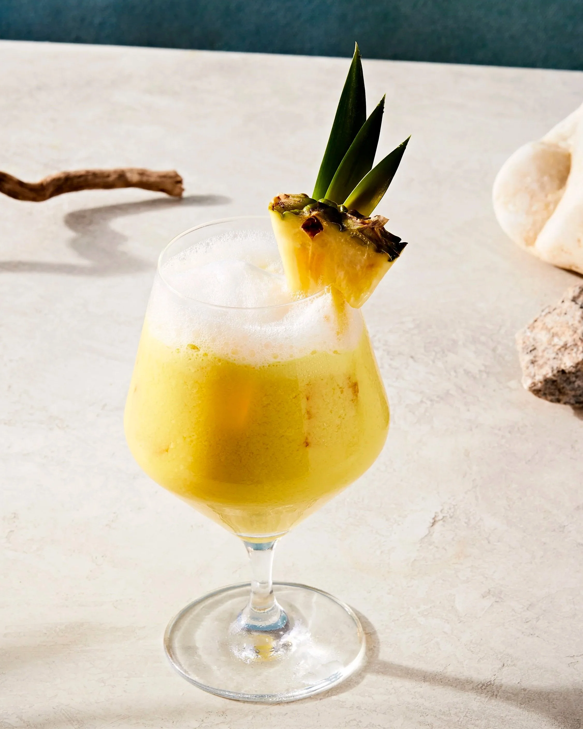Pina Colada cocktail with a pineapple garnish, photographed by Rachel Vanni - food styling, commercial food stylist NYC