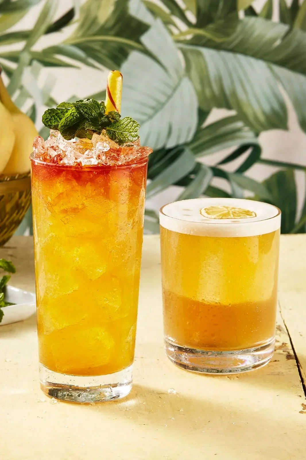 Two tropical cocktails with mint and foam as garnish - shot for whisky advocate magazine, photographed by Jeff Harris - food styling, commercial food stylist NYC