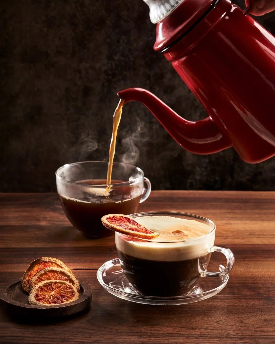 Two hot coffee cocktails with orange slices as garnish - shot for whisky advocate magazine, photographed by Jeff Harris - food styling, commercial food stylist NYC