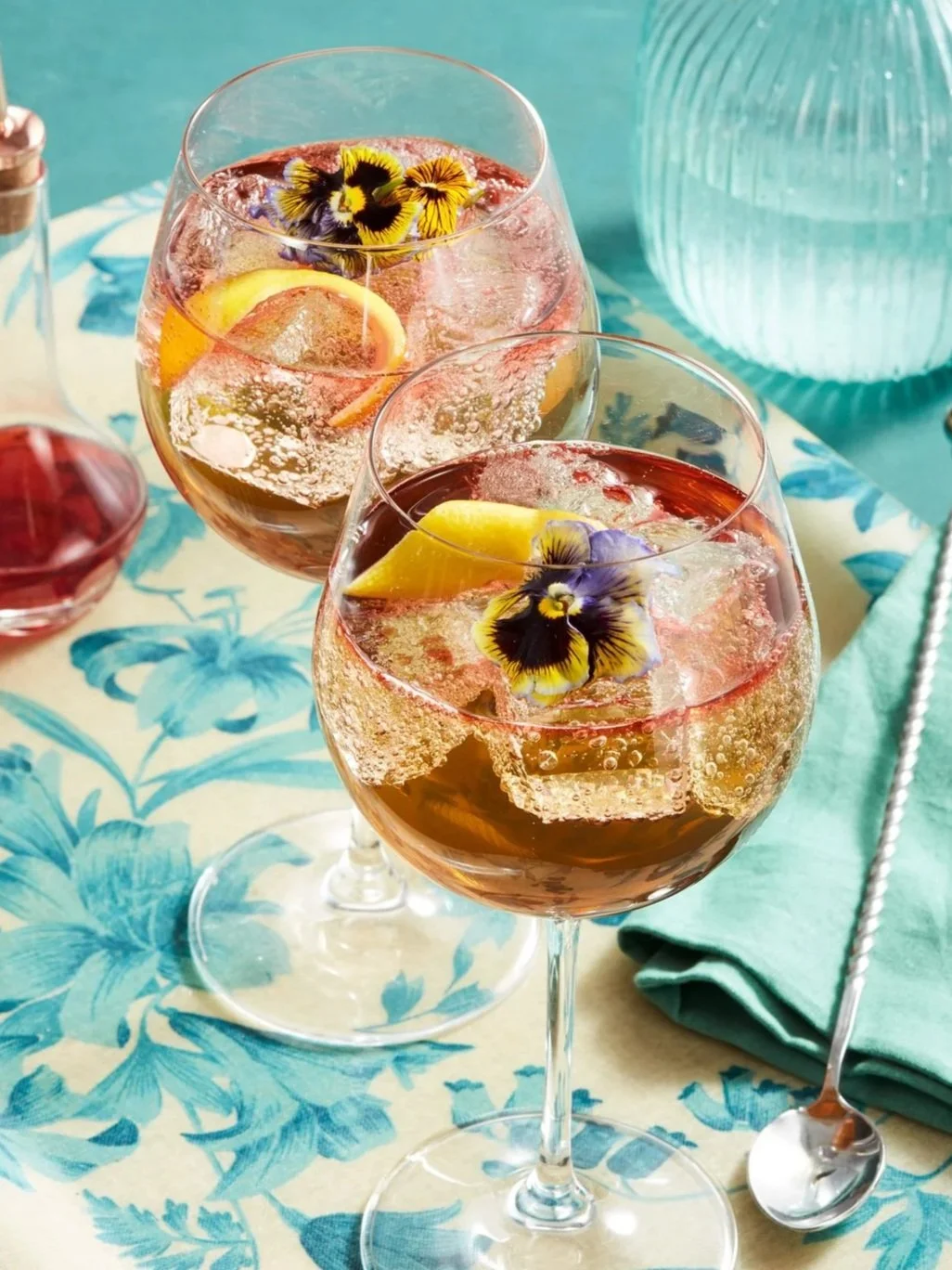 Two cocktail spritz with flowers as garnish - shot for whisky advocate magazine, photographed by Jeff Harris - food styling, commercial food stylist NYC