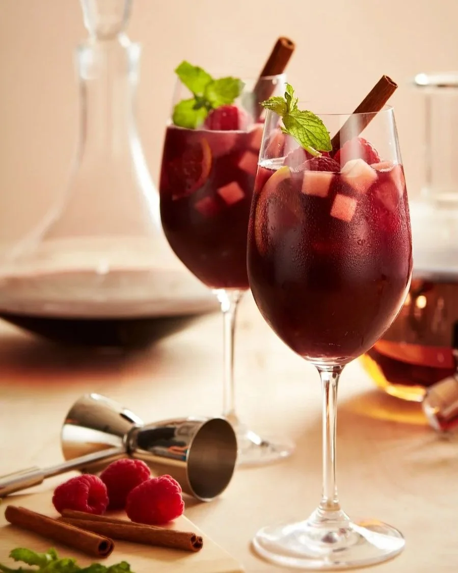 Mulled wine cocktails with cinnamon and fruit as garnish - shot for whisky advocate magazine, photographed by Jeff Harris - food styling, commercial food stylist NYC