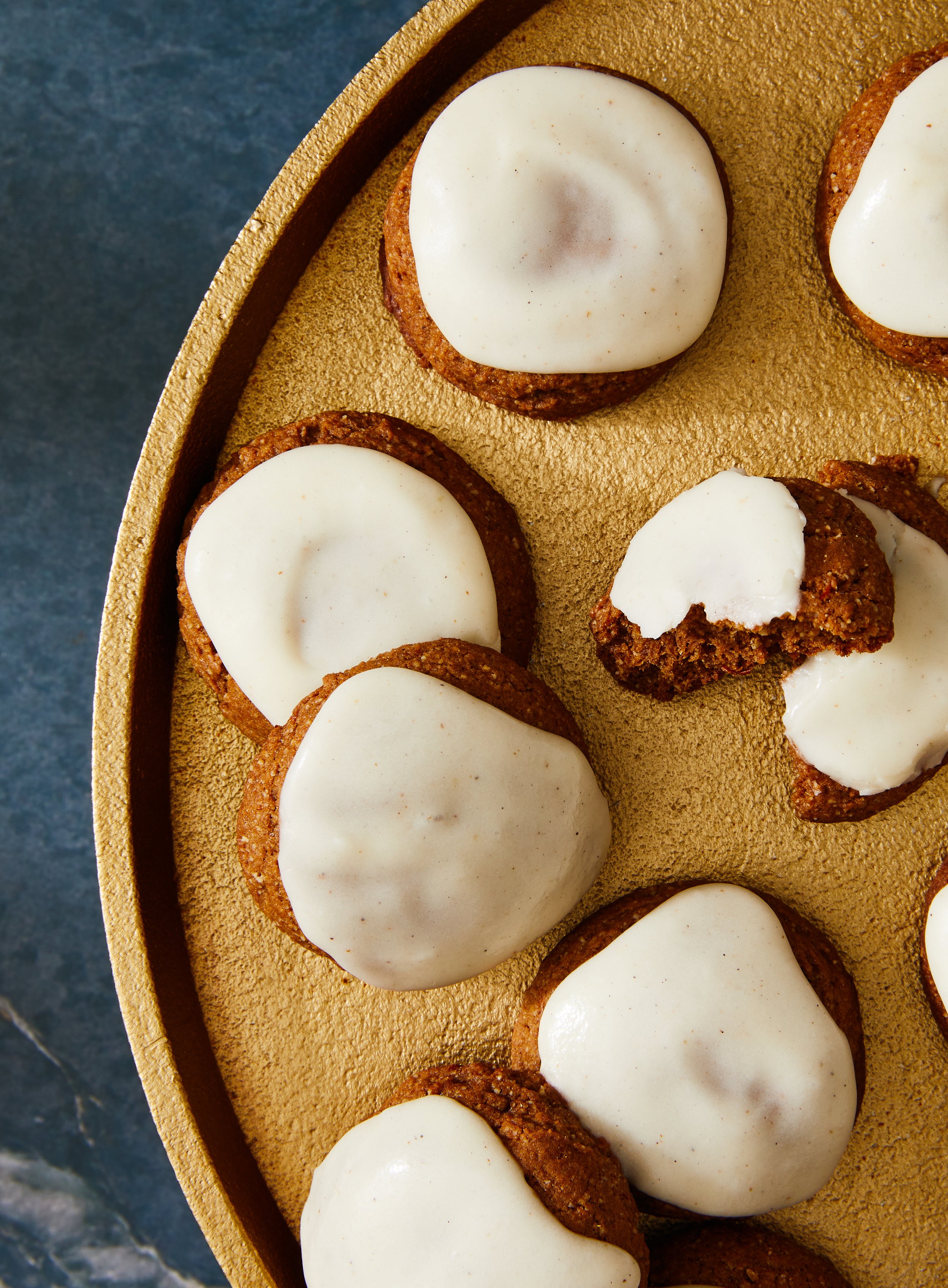 Ginger cookies on a platter with icing on top, photographed by Rachel Vanni for Delicious magazine - food styling, commercial food stylist NYC