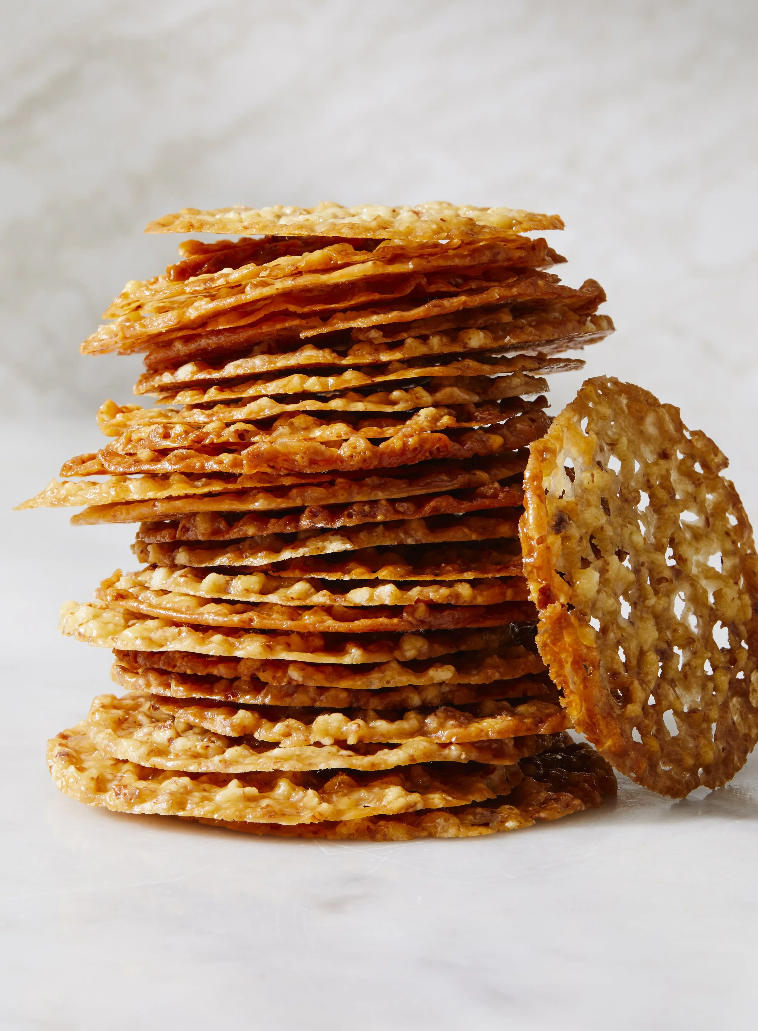 Almond Lace Cookies in a stack, photographed by Rachel Vanni for Delicious magazine - food styling, commercial food stylist NYC