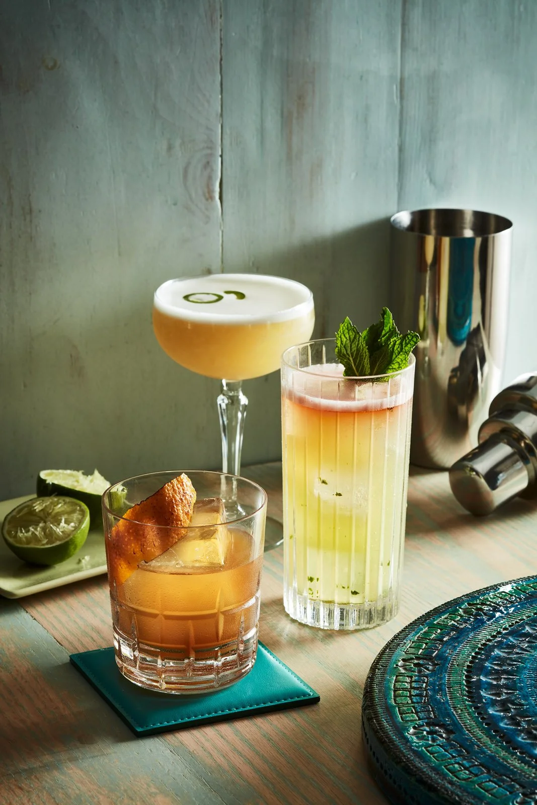 Three different cocktails on a surface each with a different tequila - shot for whisky advocate magazine, photographed by Jeff Harris - food styling, commercial food stylist NYC