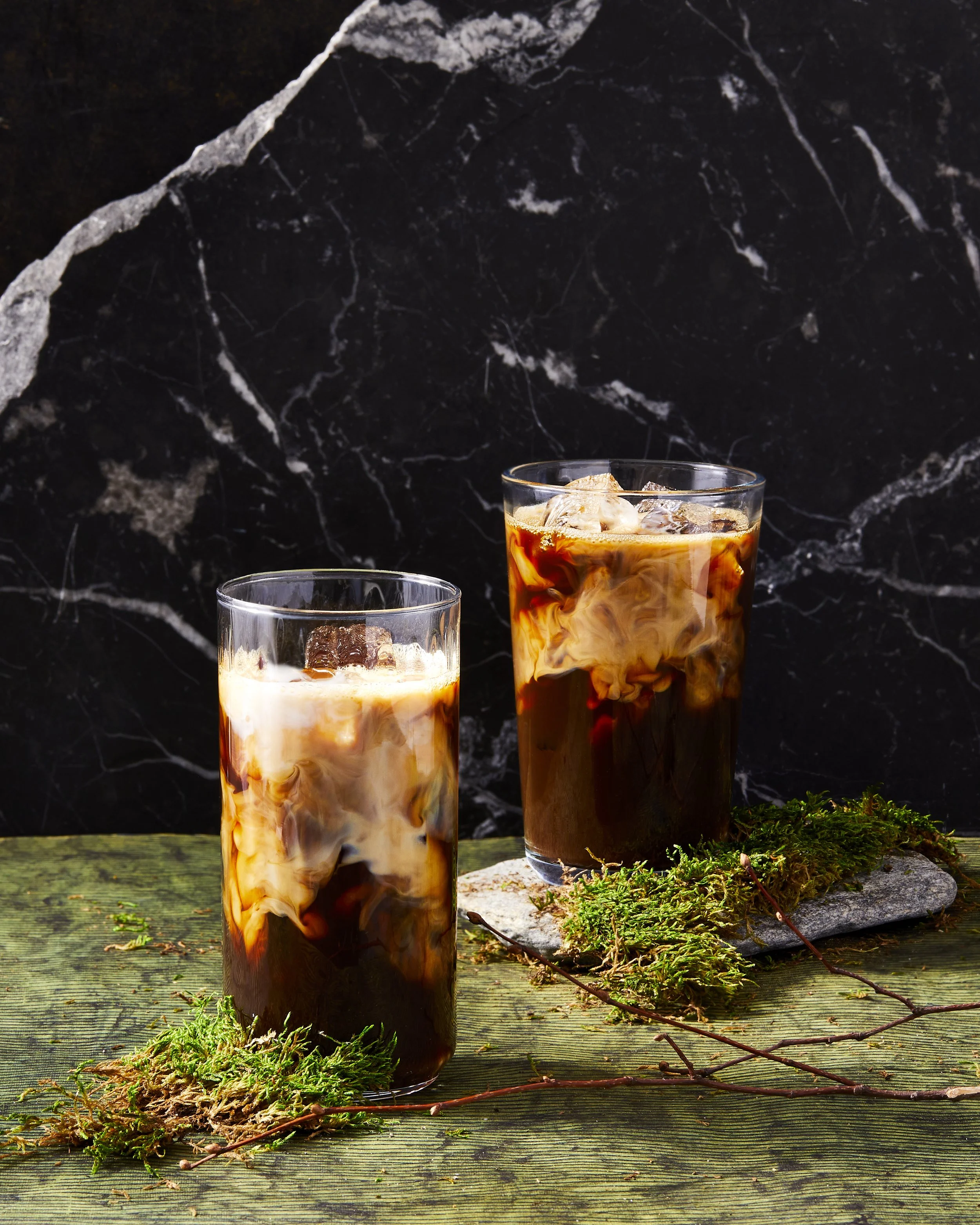 Concept shoot - iced coffee in mix swirl on a dramatic surface and background - food styling, commercial food stylist NYC photographed by Rachel Vanni