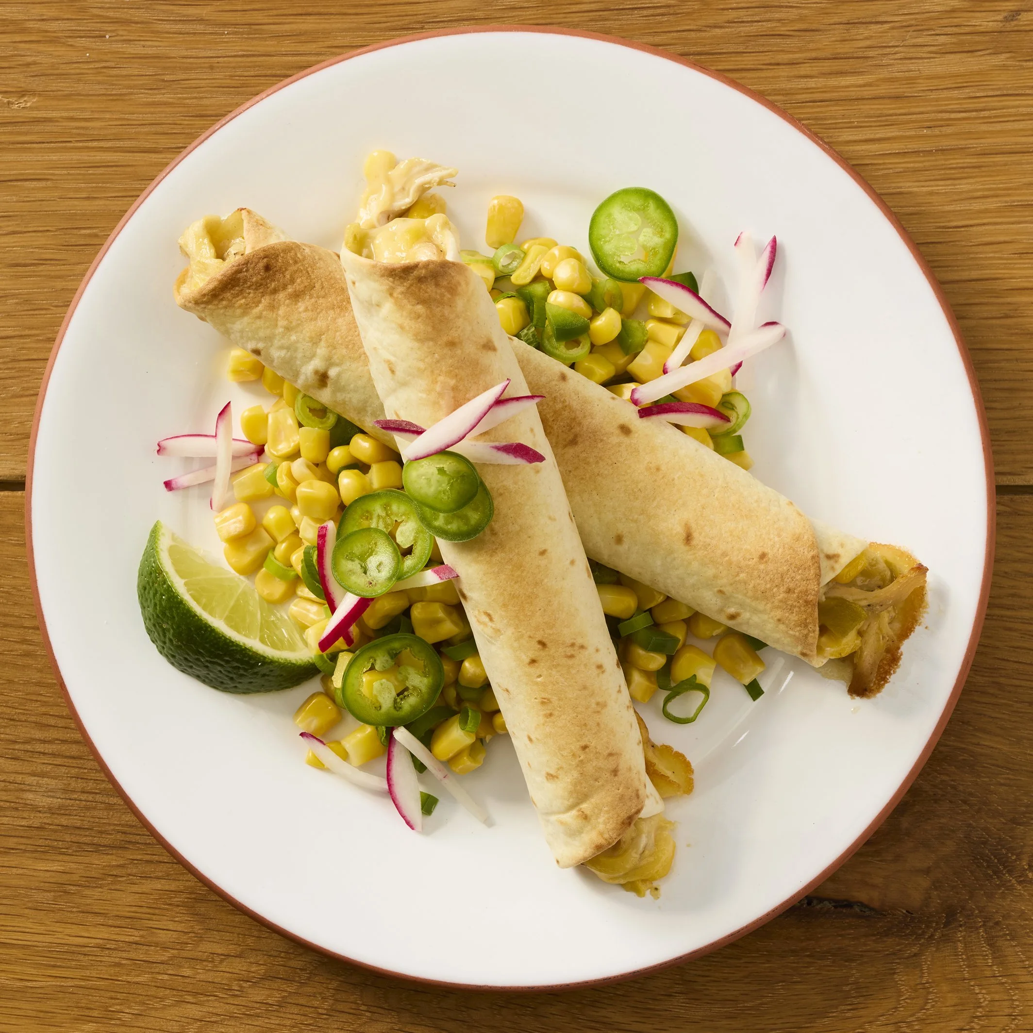 A plate of taquitos of chicken and corn salsa - shot for Campbell's Food Group - photographed by Johnny Fogg - food styling, commercial food stylist NYC
