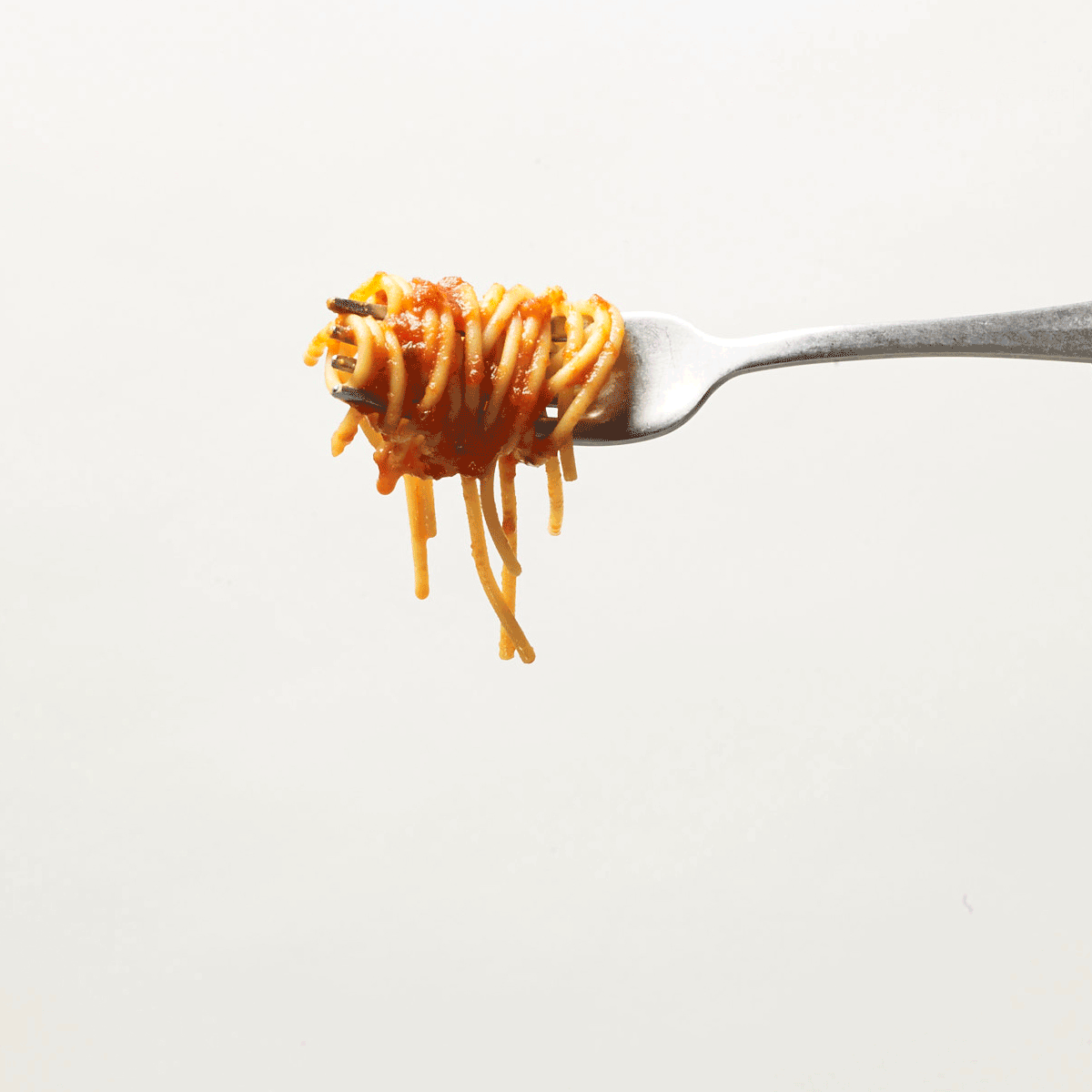 Stop motion of a single for twisting cooked spaghetti with red sauce - shot for WW magazine, photographed by Alexandra Rowley - food styling, commercial food stylist NYC