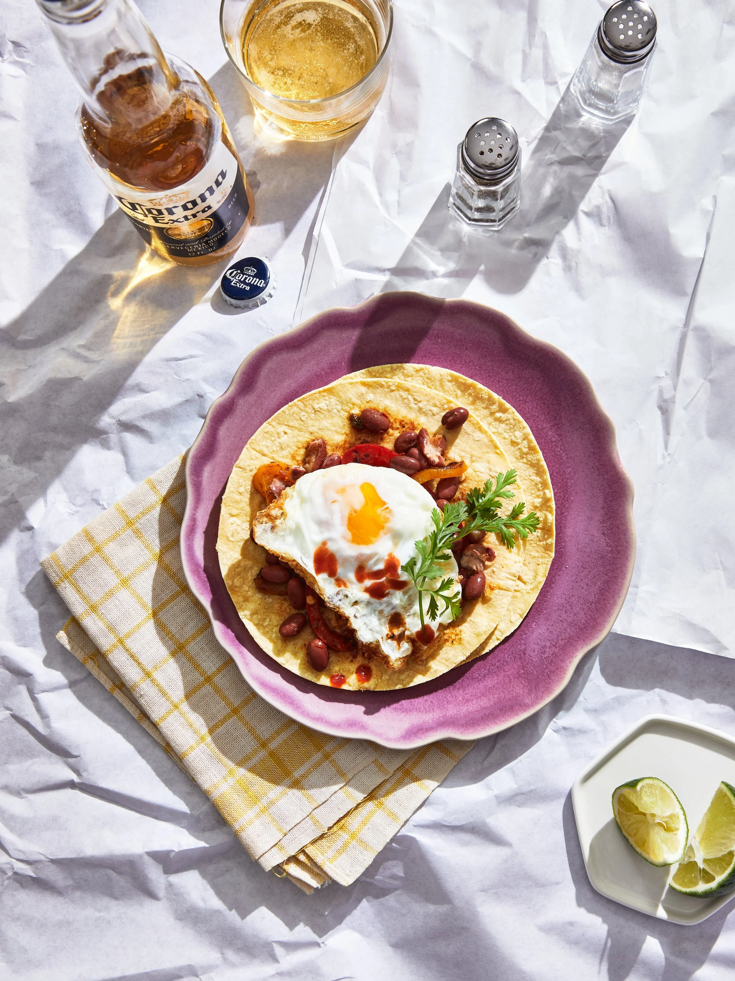 Test shoot featuring eggs - showing a Mexican fried egg breakfast taco on a tabletop - food styling, commercial food stylist NYC