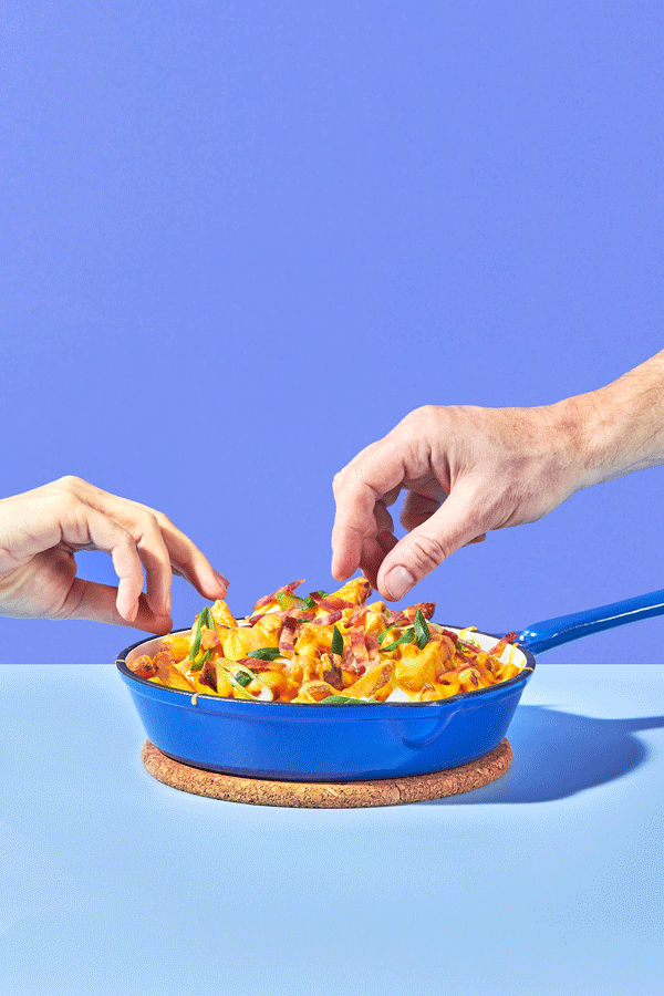 Loaded fried with cheesy pull in stop motion - food styling, commercial food stylist NYC