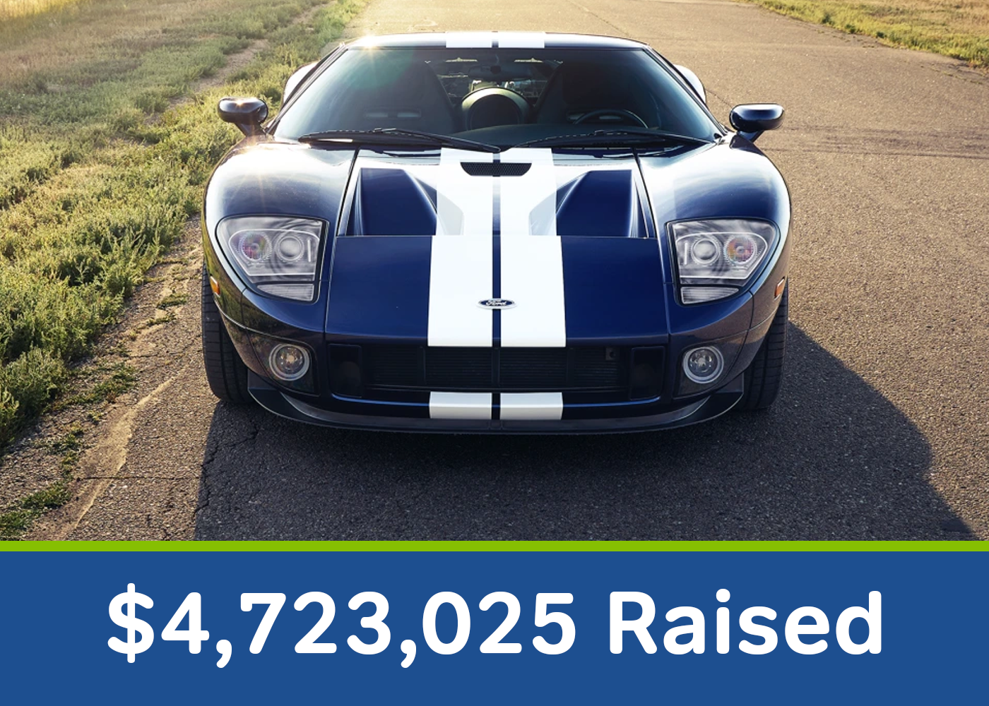 Black sports car with white racing stripes parked outdoors during daytime