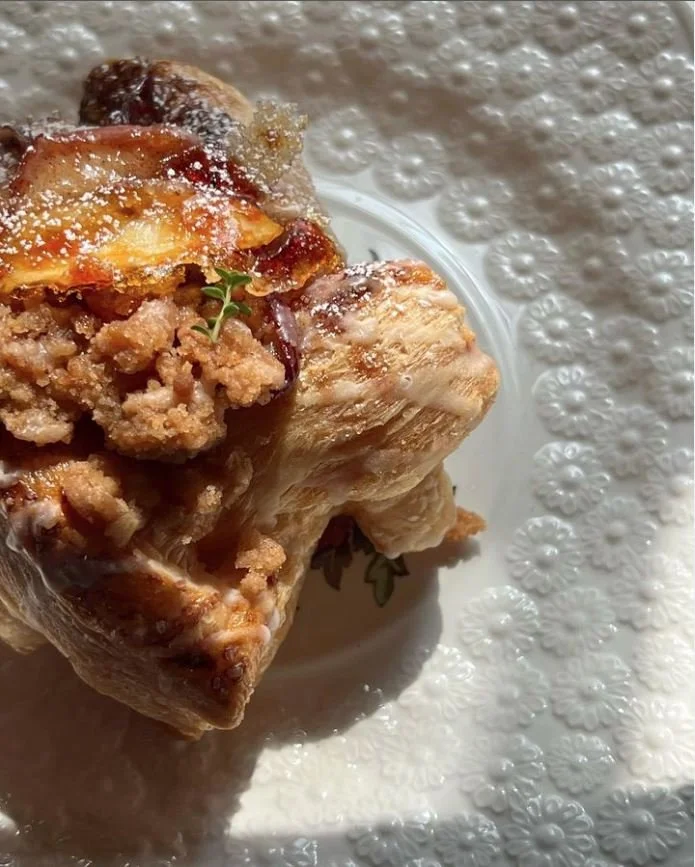 Light flaky layers of buttery pastry filled with spiced roasted peaches, a gently sweet crumble, a drizzle of maple glaze, and finished a bruleed slice of fresh summer peach. The spiced maple peach danish at The Bakery at 1871.