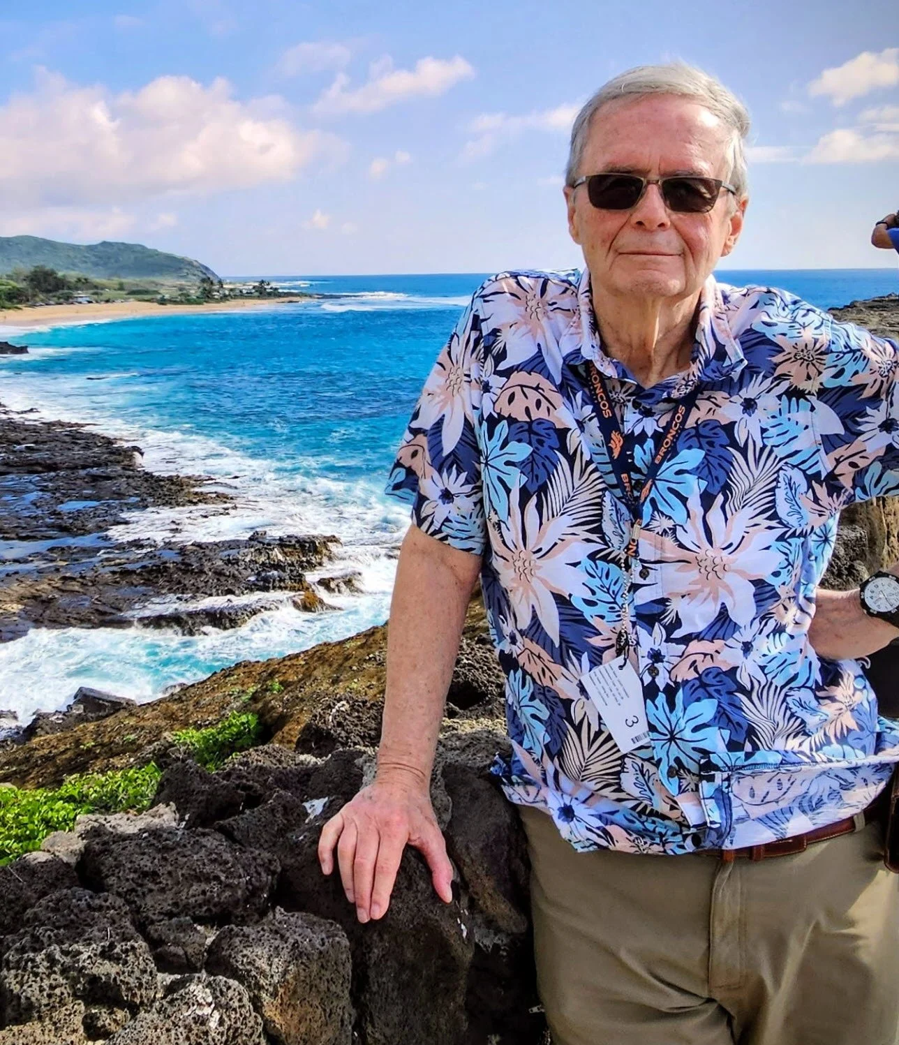 Author David Tanner standing front of a rocky bay