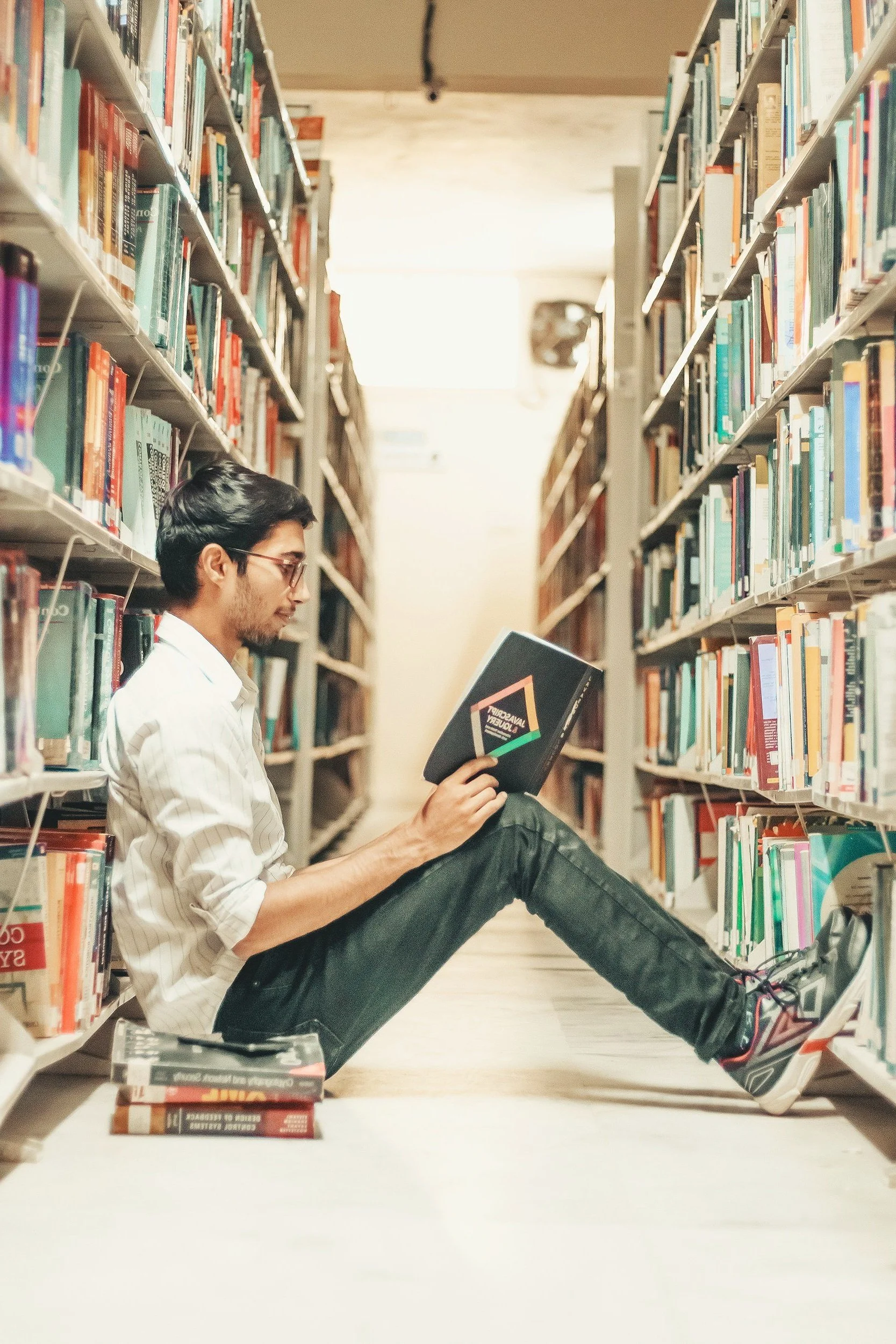 a college of charleston student reading a book about adhd