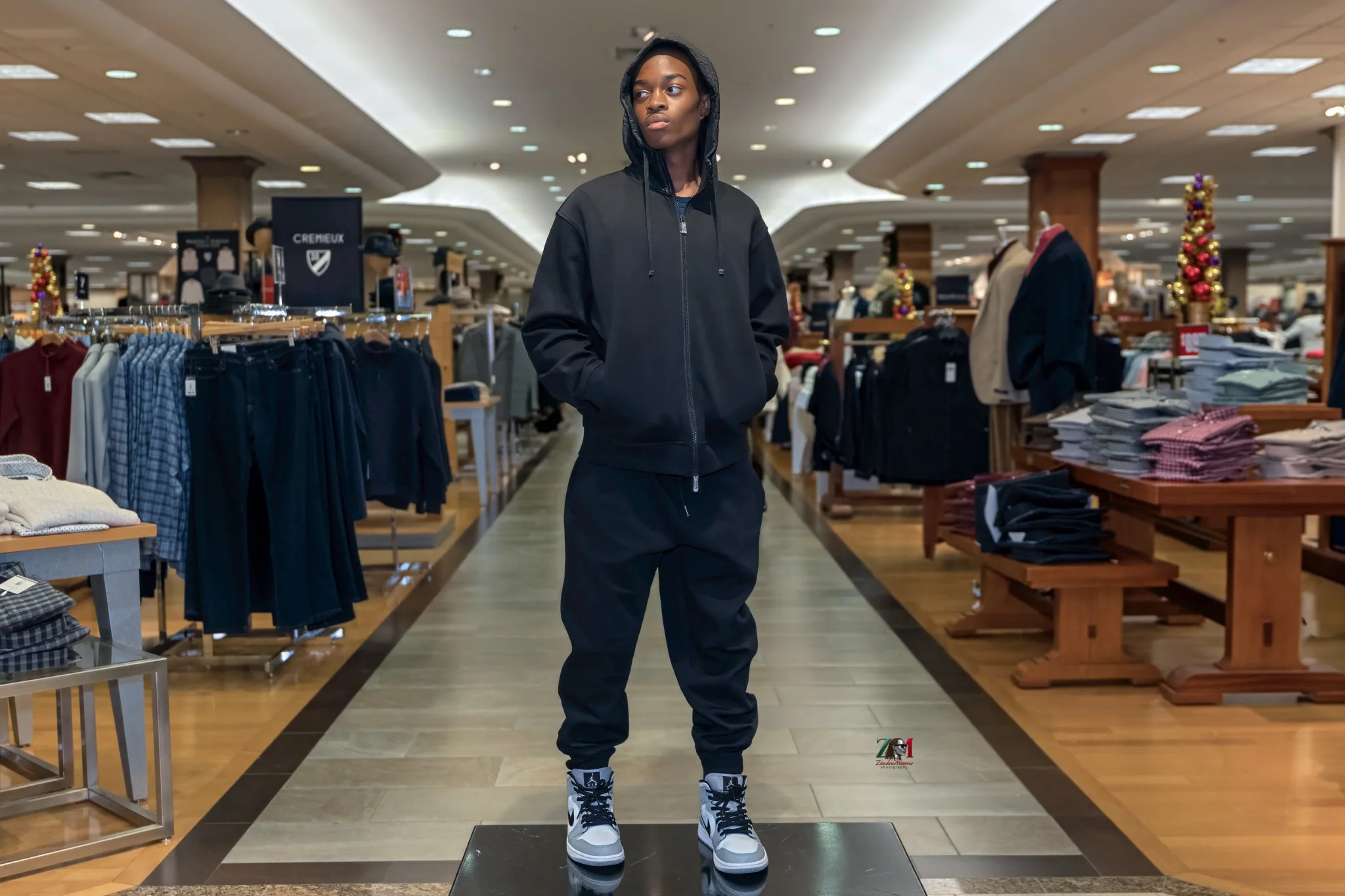 Man modeling outfit in clothing store