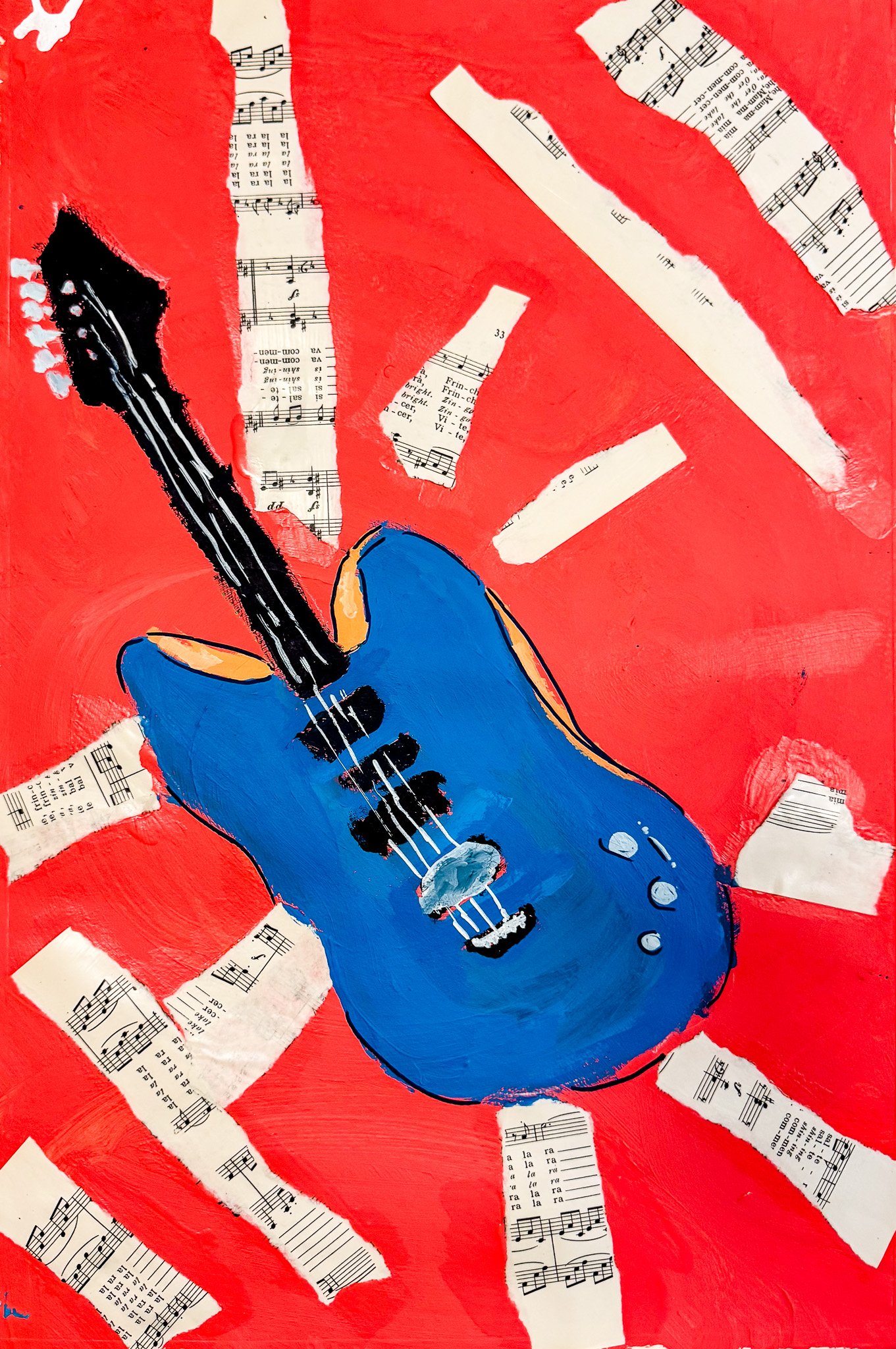 Painted blue electric guitar with black strings and tuning pegs, surrounded by torn sheet music on a red background.