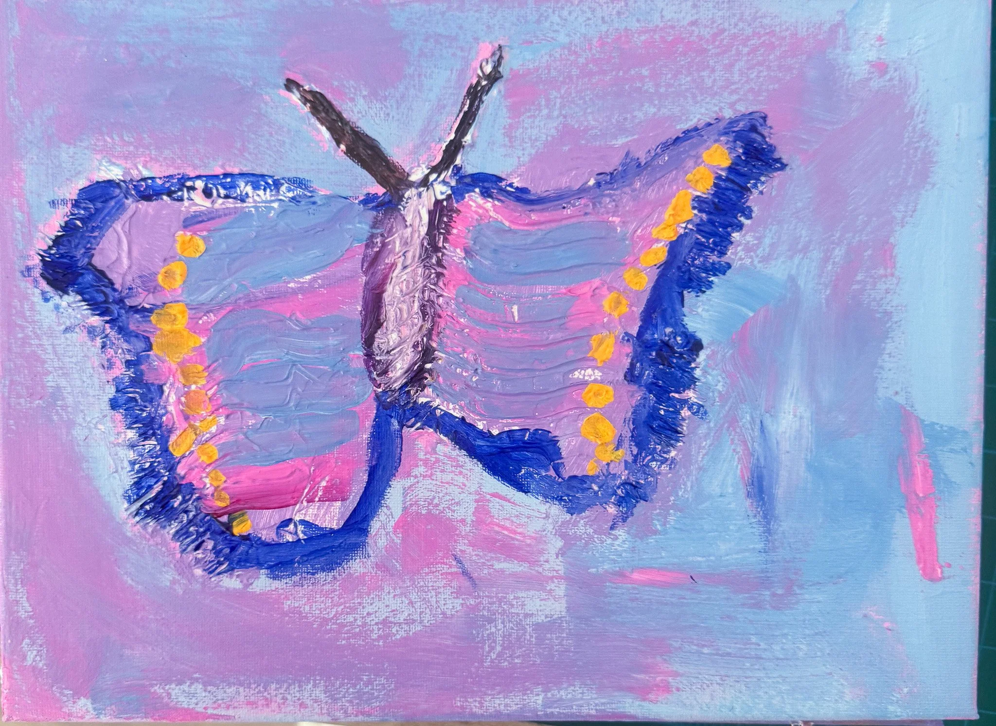 An abstract painting of a butterfly with pink and purple wings outlined in dark blue and yellow dots along the edges, on a light pink and blue background.