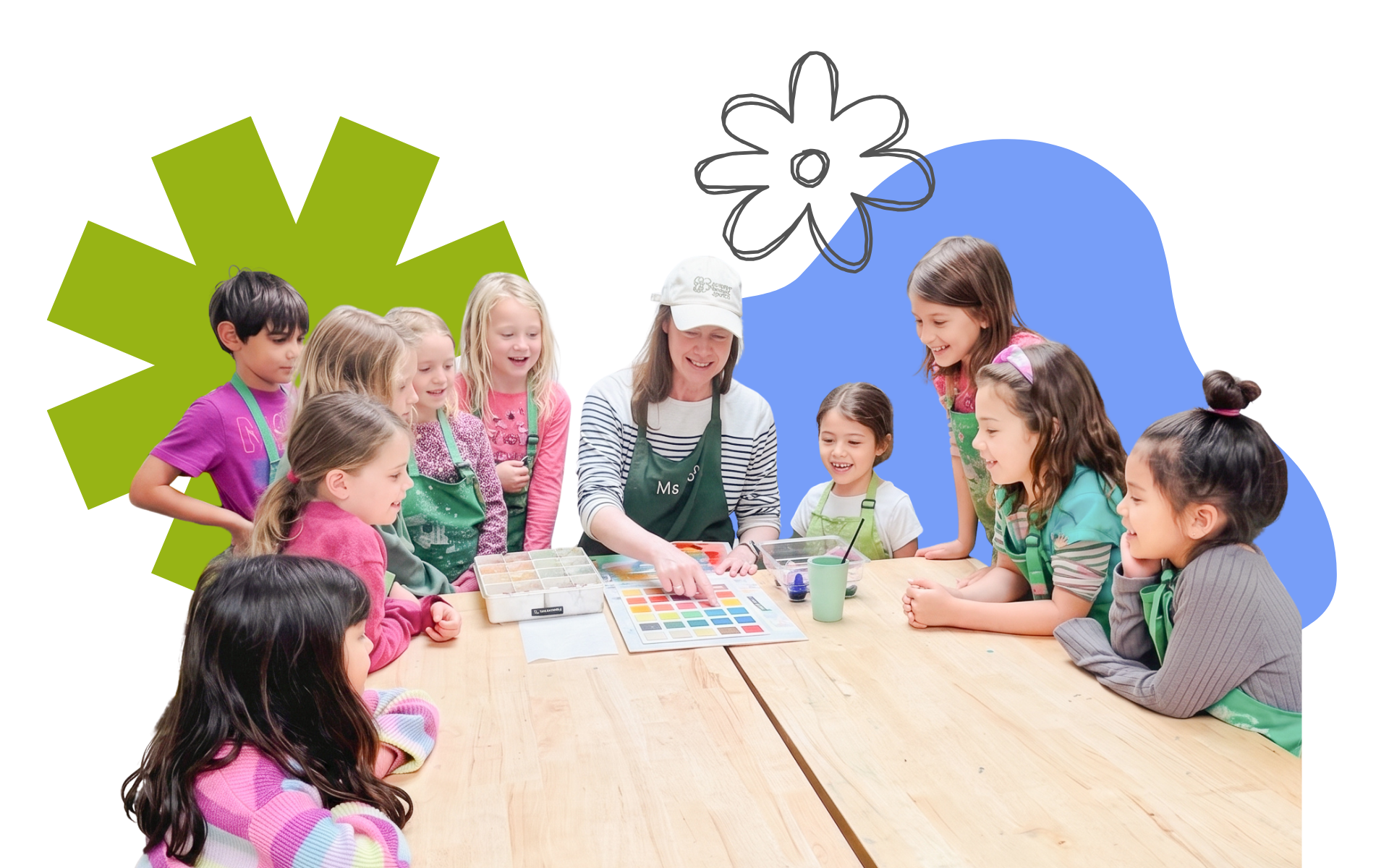 A group of children and a woman in a classroom engaged in an art activity, with paint supplies and a color chart on the table.