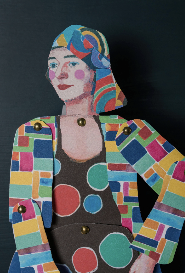 A colorful, abstract paper collage of a woman's portrait with vibrant patterns and geometric shapes.