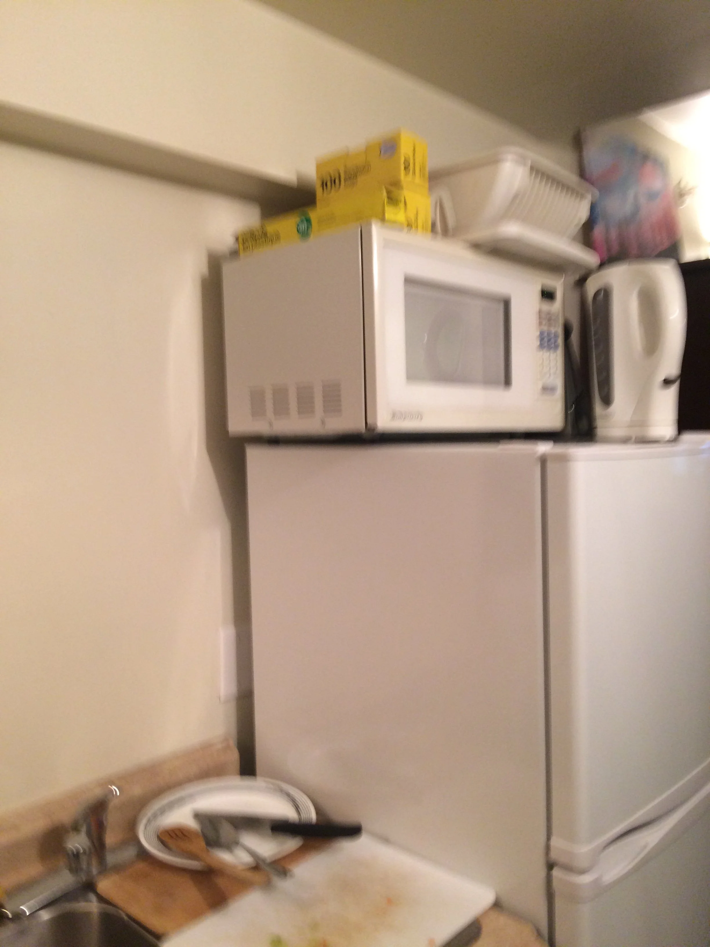 Kitchen with no storage. M/W too high to use safely