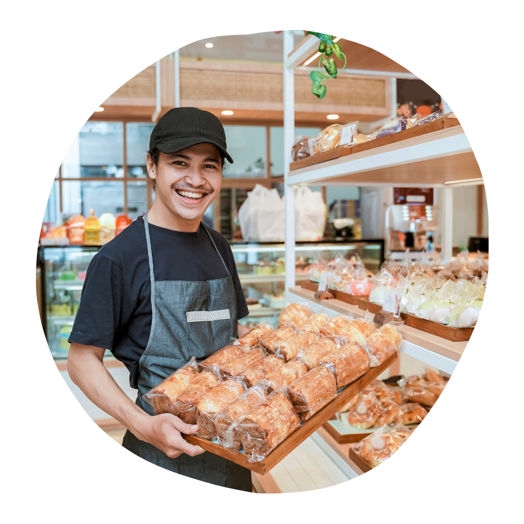 Smiling baker bookkeeping