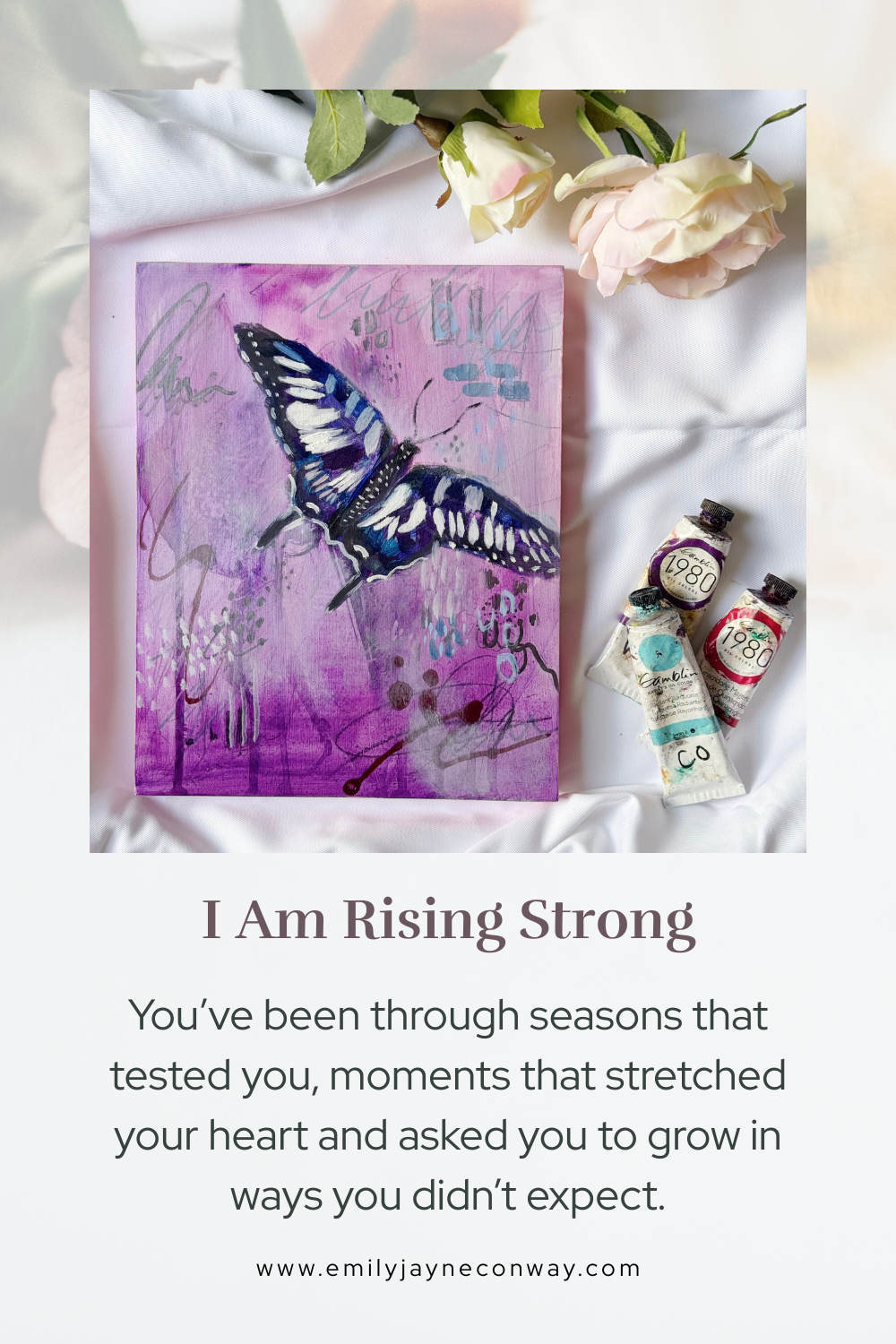 A painting of a blue and black butterfly on a purple background, with art supplies including tubes of paint and a sprig of white roses next to it. A quote card below the image reads, "I Am Rising Strong" and includes a motivational message.