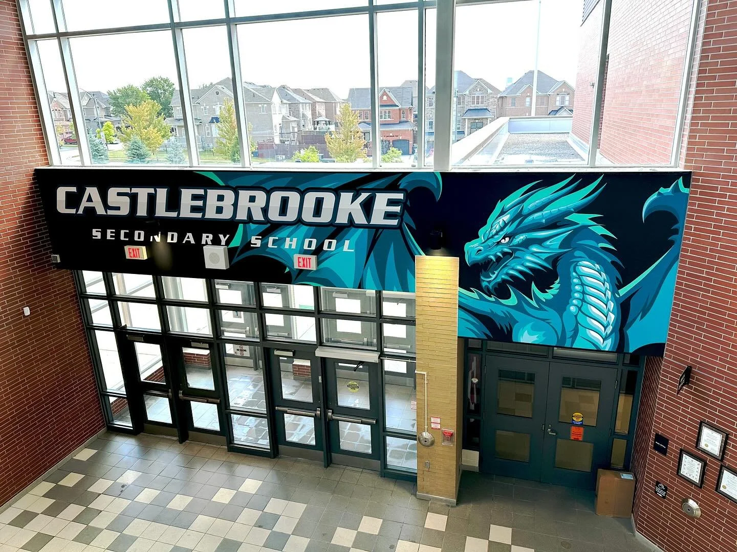 Now THIS is an entrance! 🐲#castlebrooke #castlebrookesecondaryschool #muralart #mural #dragon #schoolmural #publicart #artist #artistlife #muralpainting #painting #walldeco