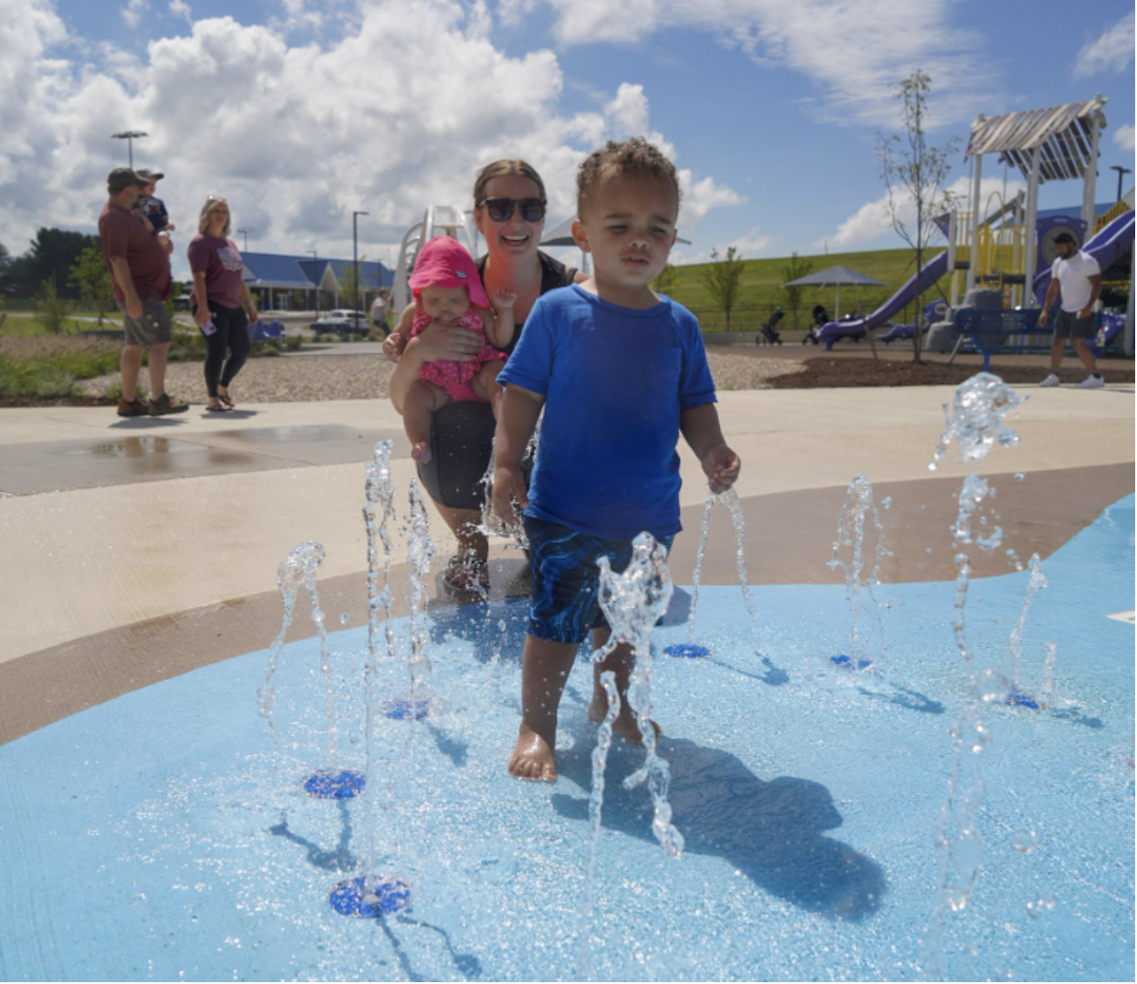 Child playing in splash pad