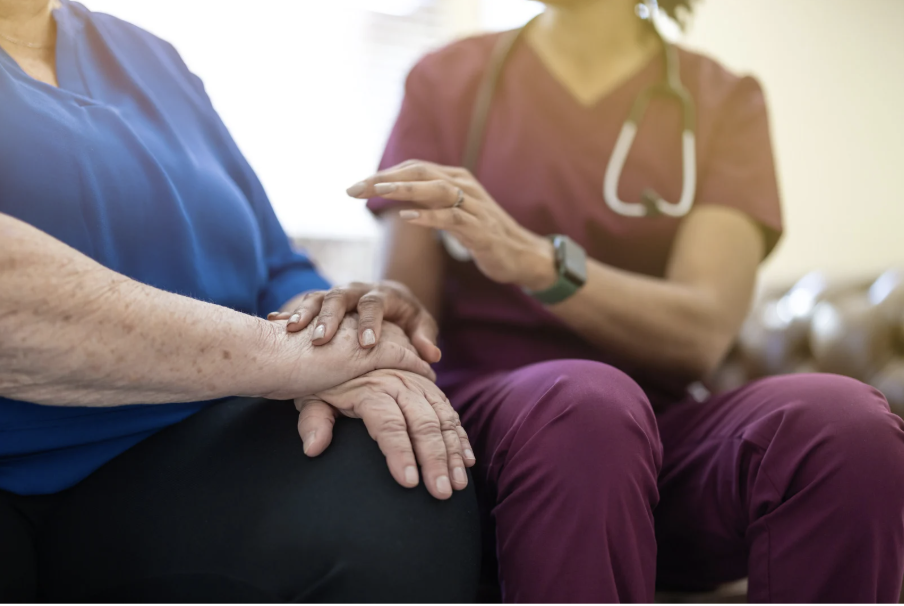 Nurse comforting patient